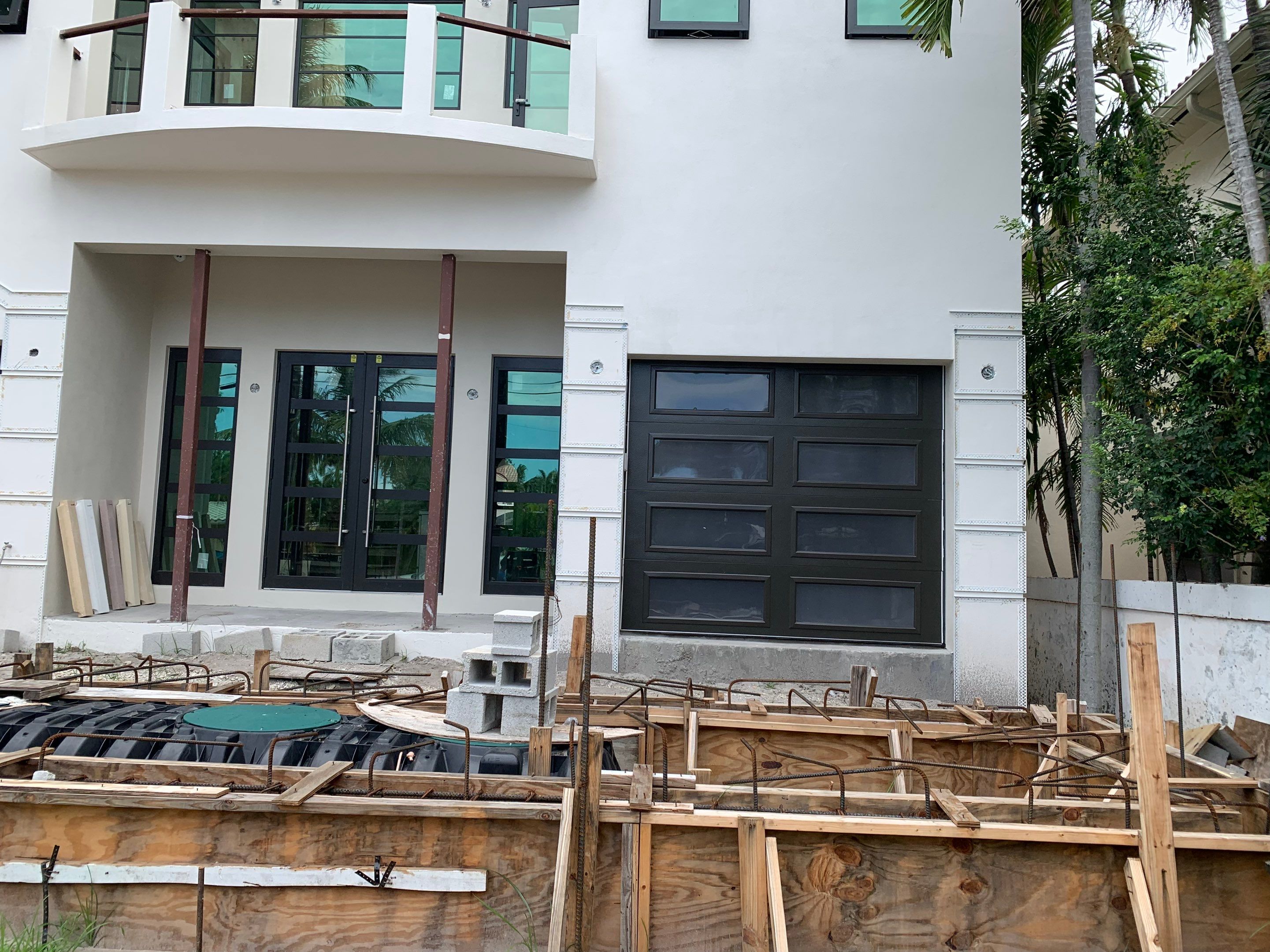 Modern Garage Door Installation for New Construction – Las Olas Isles, Fort Lauderdale, FL by The Door Doctor of South Florida, Inc.