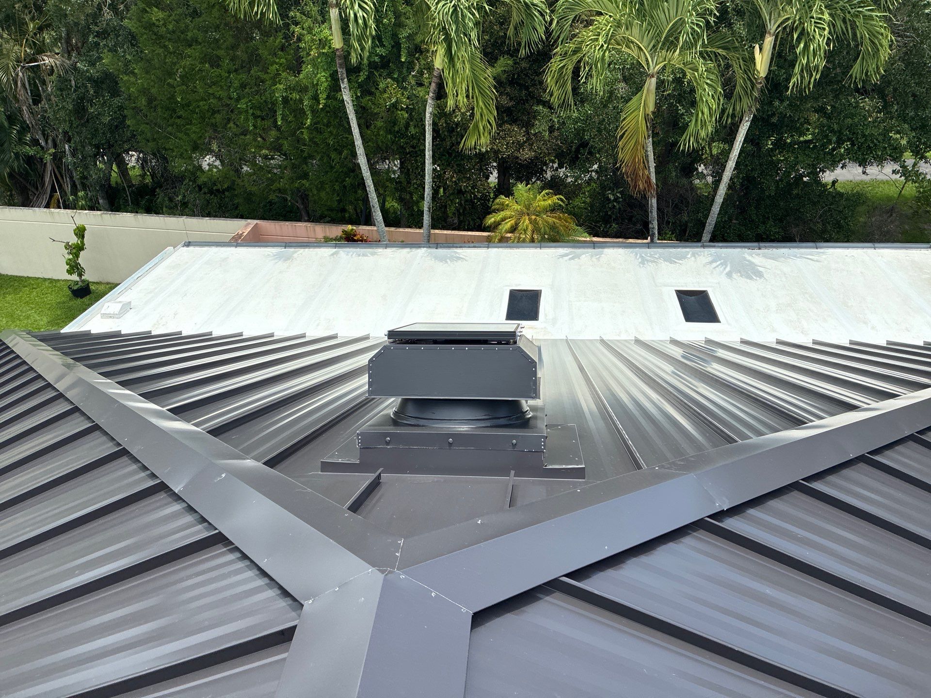 24ga 1.5" Mechanical Seam Dark Bronze by Total Roofing System The Metal Roof Experts