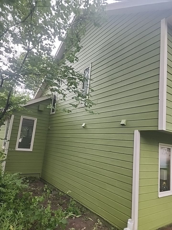 Complete house repaint to a different color  by Cutting edge painting 