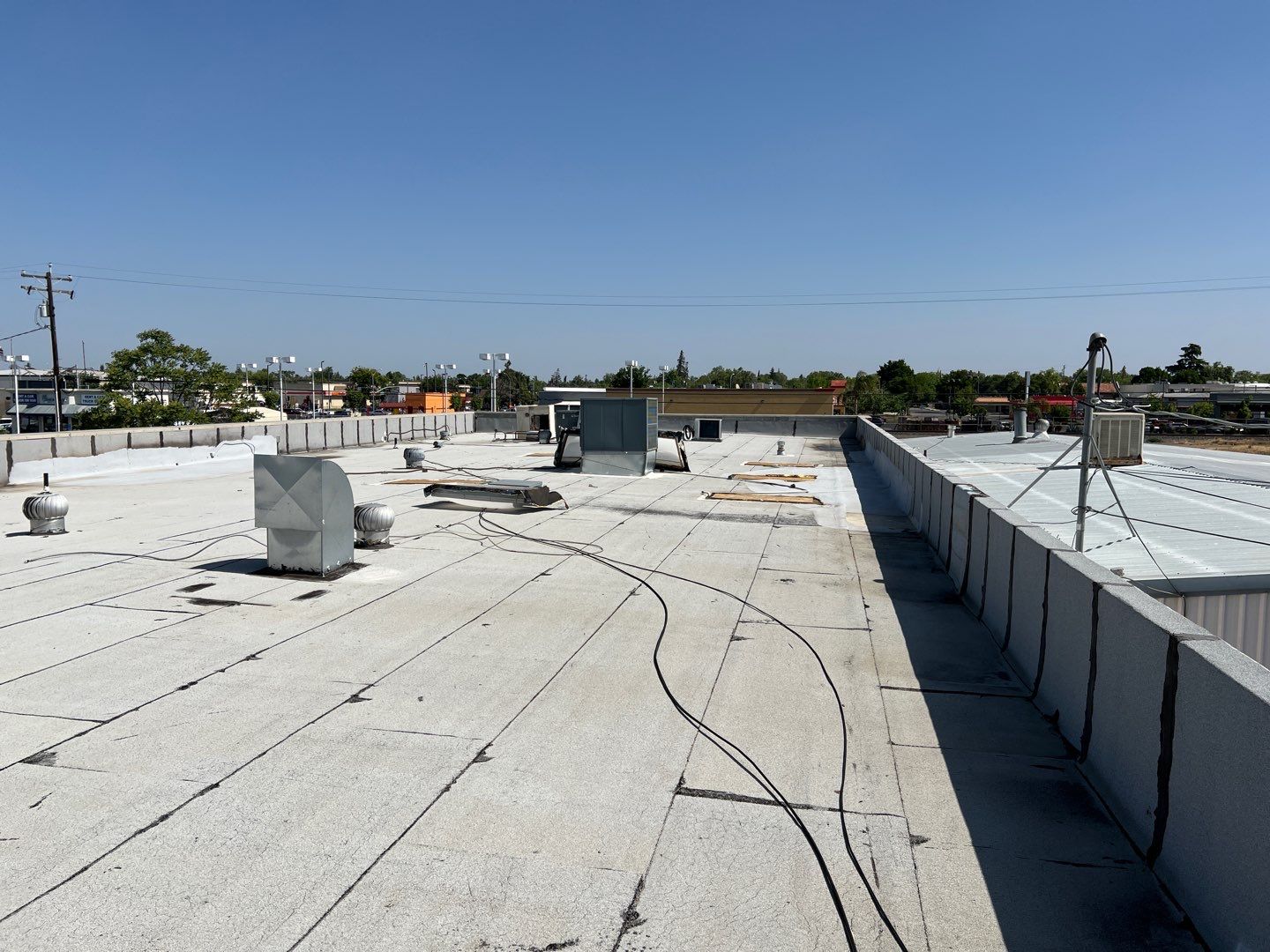 Spray foam and coatings using Conklin Benchmark/PUMA XL coatings and spray foam by Straight Edge Roofing Inc