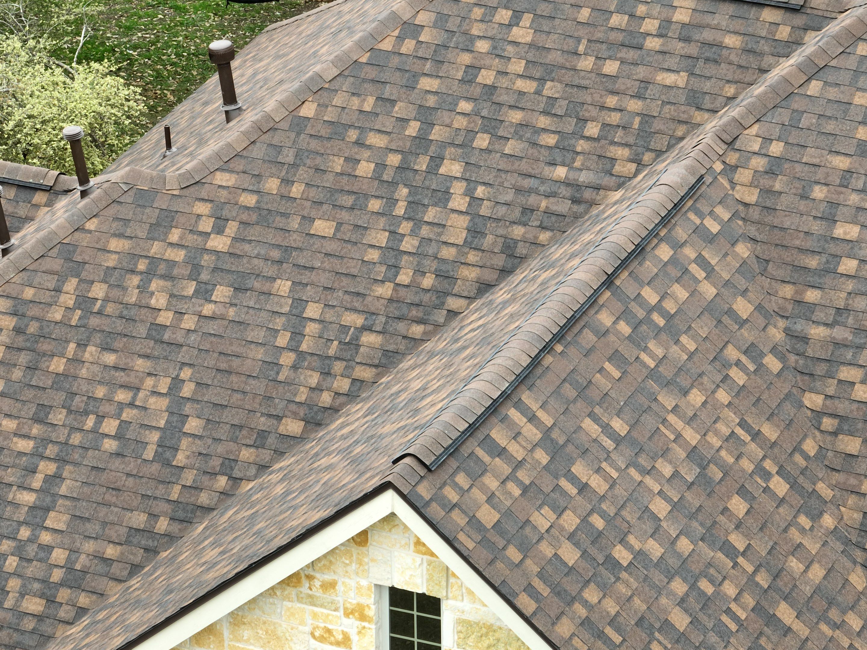 Residential Roof Replacement using 30 Year Laminate Shingles with High Profile Ridge by Premier Roofing and Contracting