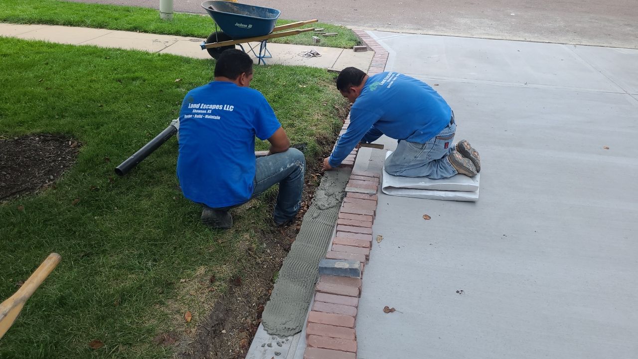 New Driveway and Sidewalk by LAND ESCAPES LLC