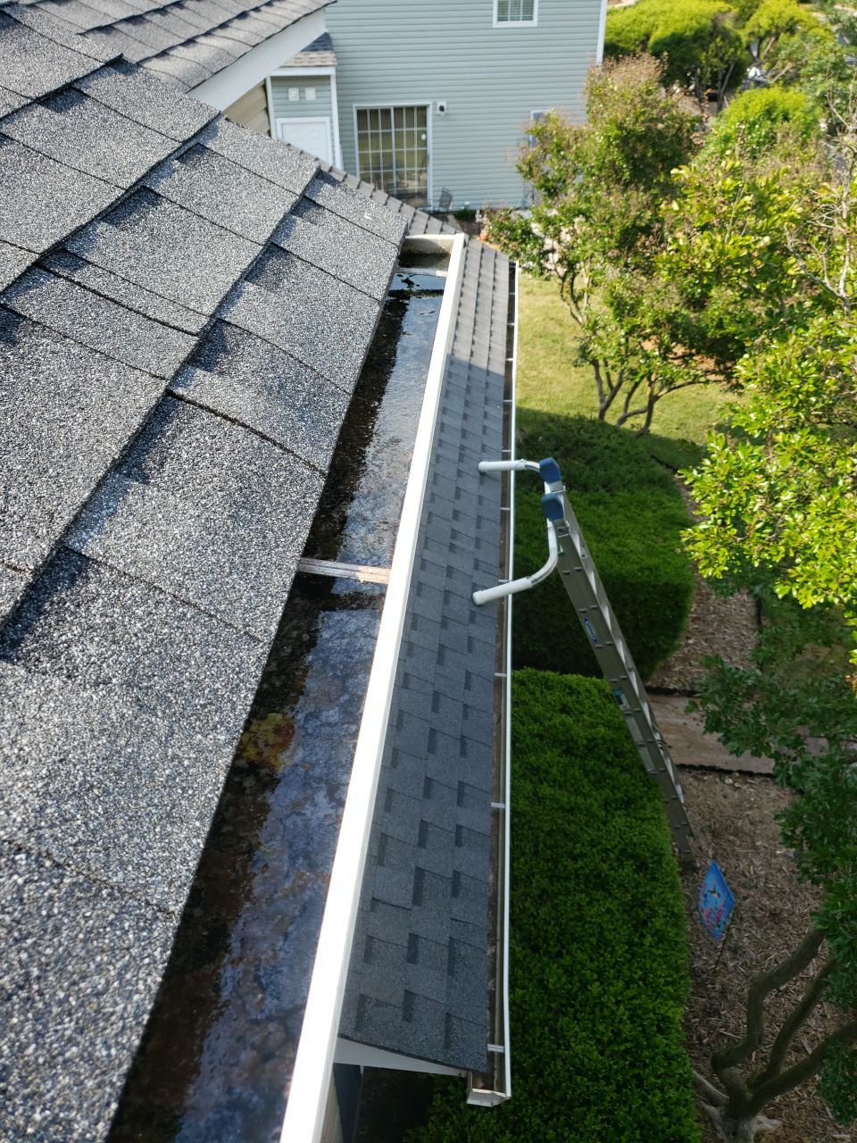 Gutter Cleaning using water by Power Wash Masters LLC