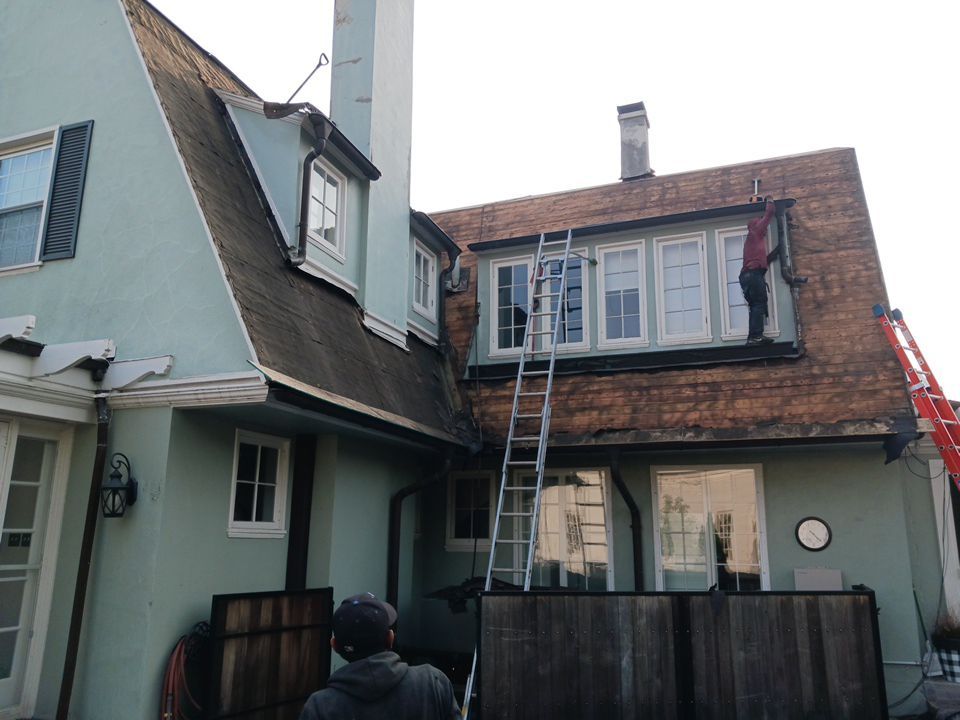 Slate removal/Cedar Shake replacement by Storm Contracting 