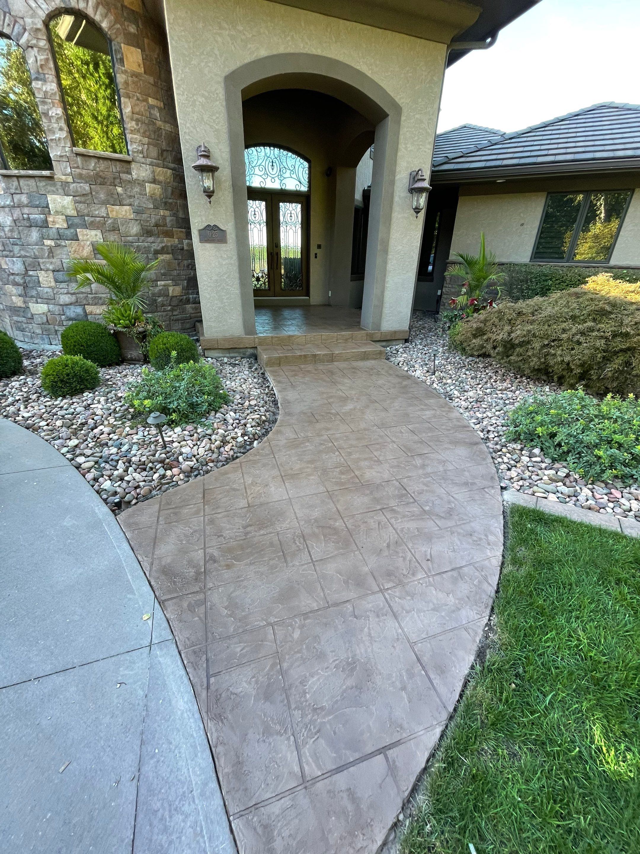 Lake Lotawana -- Front Walkway and Back Patio Tuscan Overlay by Big Red Decorative Concrete, LLC