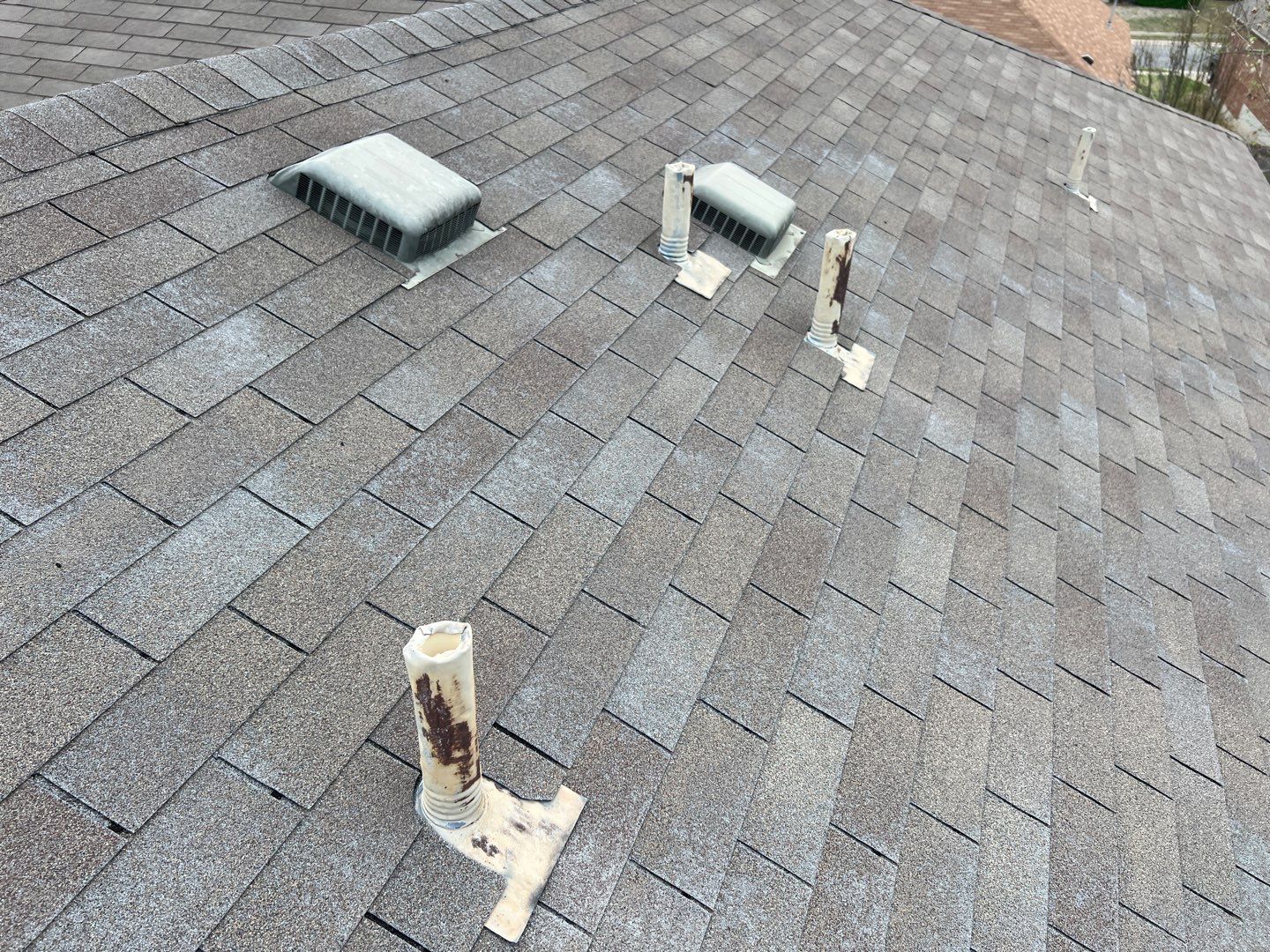 Wind damaged roof replacement by Oakwood Roofing and Construction, LLC