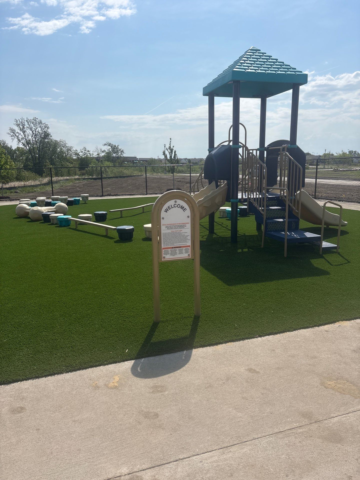 Everbrook in Grimes Playground Equipment & Turf by Southwest Greens Midwest