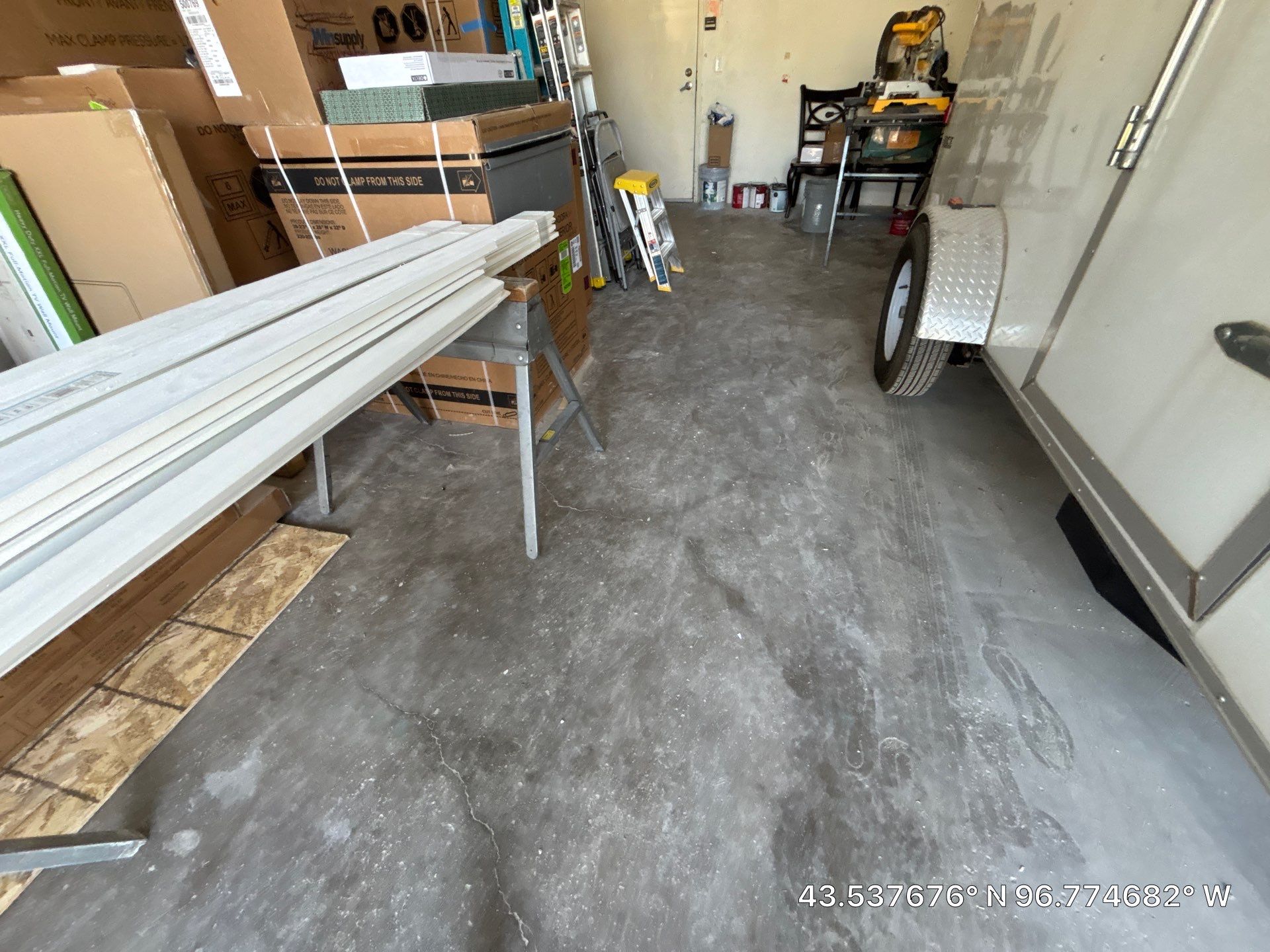 Coyote Flake Concrete Coating for Sioux Falls Garage by Select Painting, Coatings & Garage Cabinets