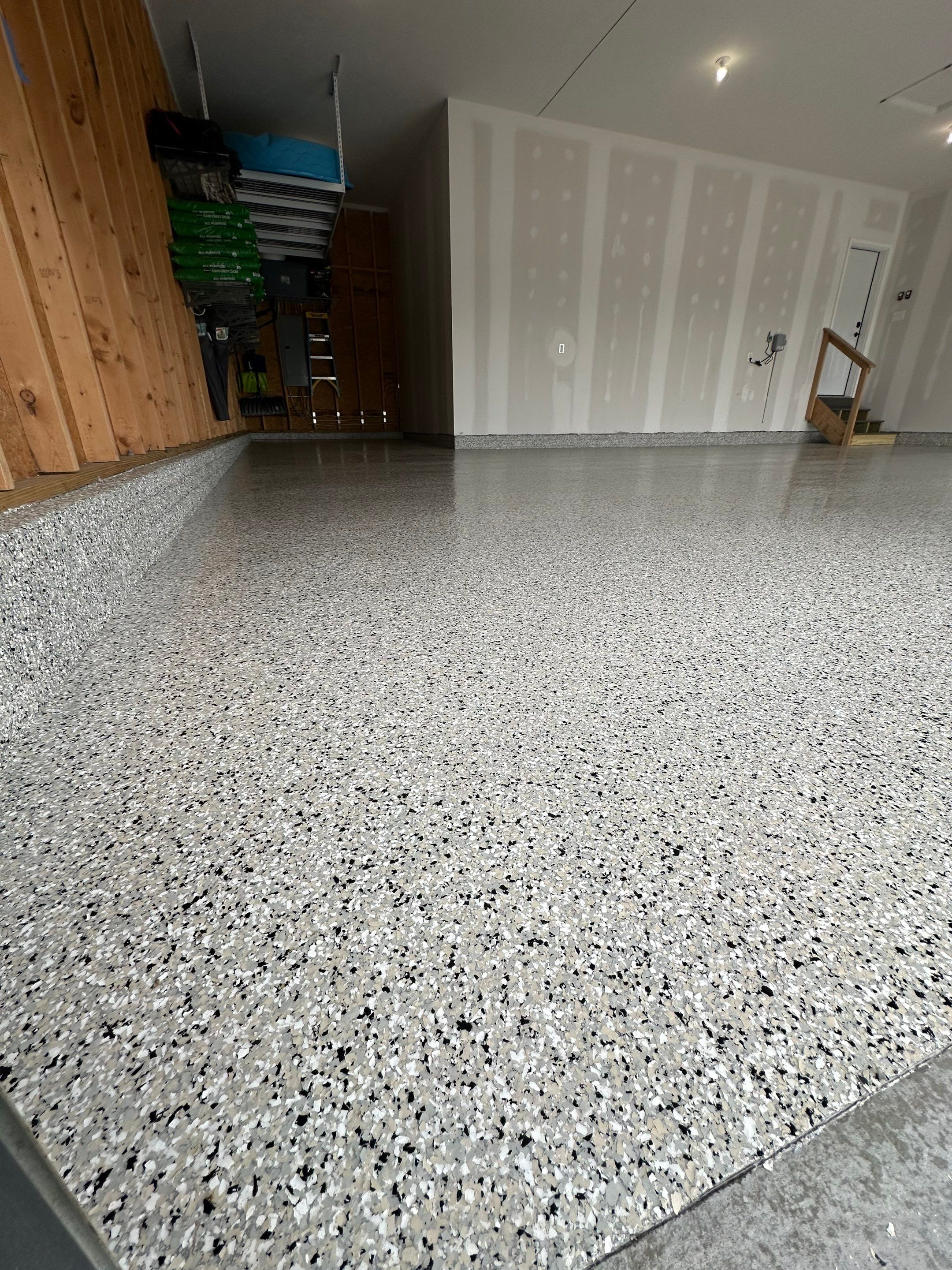 Three-Stall Garage Epoxy Floor Coating Installation in Lincoln by Goat Coatings