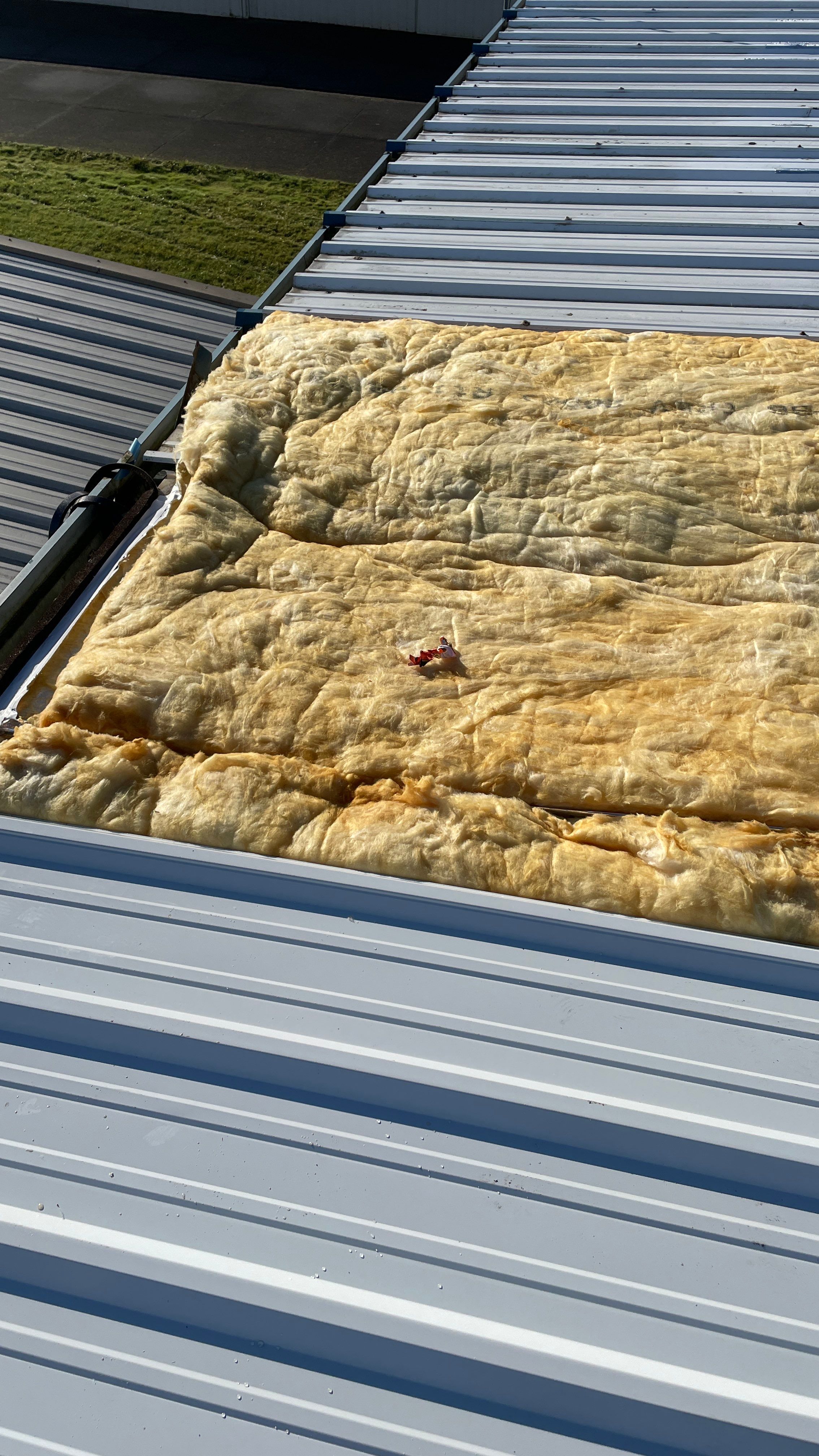 Airport Hanger Metal Roof Replacement and Insulation by Villegas Remodeling, LLC