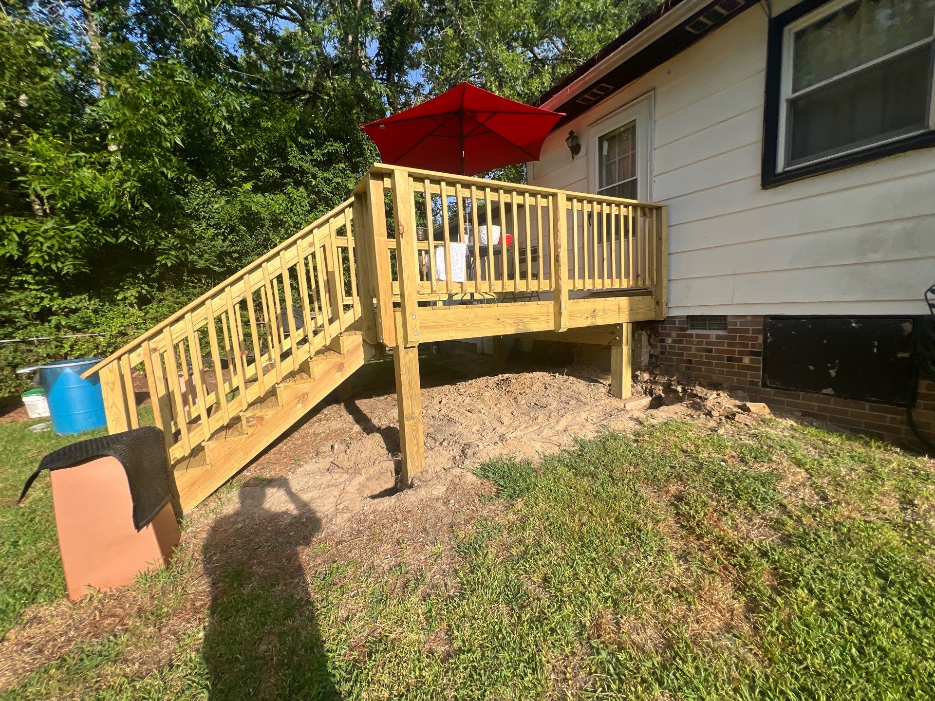 Custom Pressure-Treated Wood Deck and Staircase Construction in Raleigh by The Remodeling Company