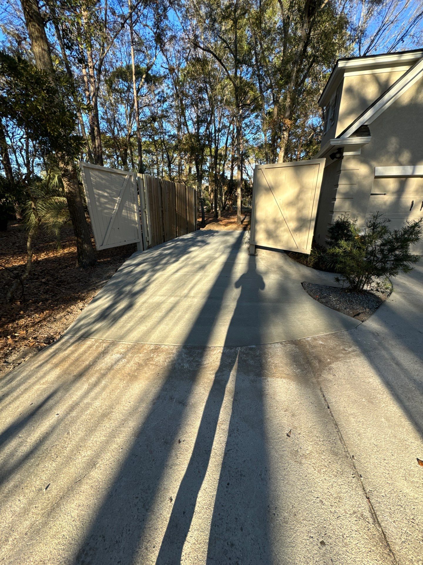 New Concrete Driveway and Privacy Fence Installation in Bluffton by Lowcountry Scapes, LLC