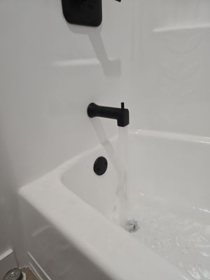 Scope of Work: Installation of Shower, Toilet, Plumbing, Kitchen Sink, and Fixtures