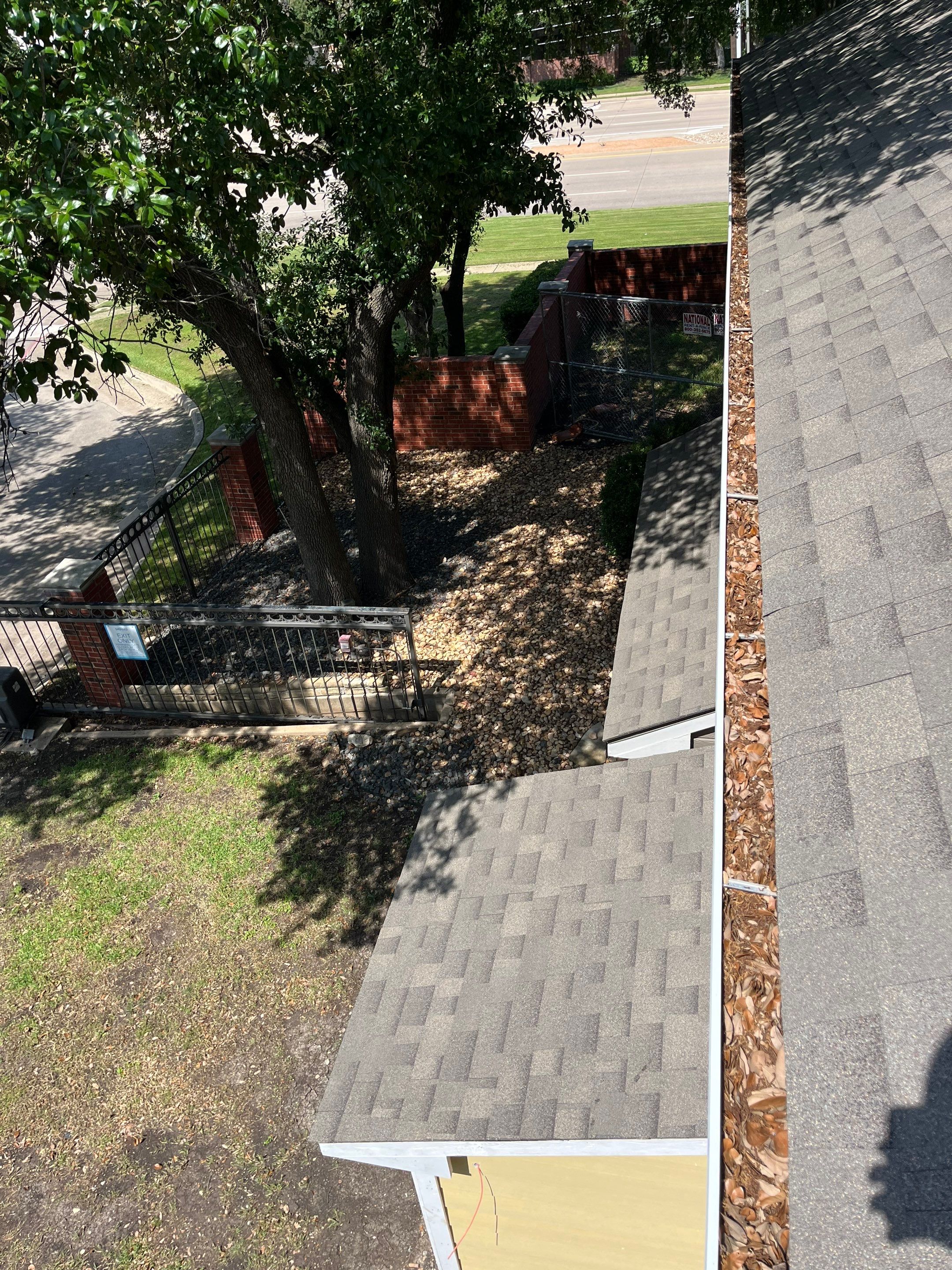 Commercial gutter cleaning Plano & Frisco & McKinney, TX	 before photo with filled gutters