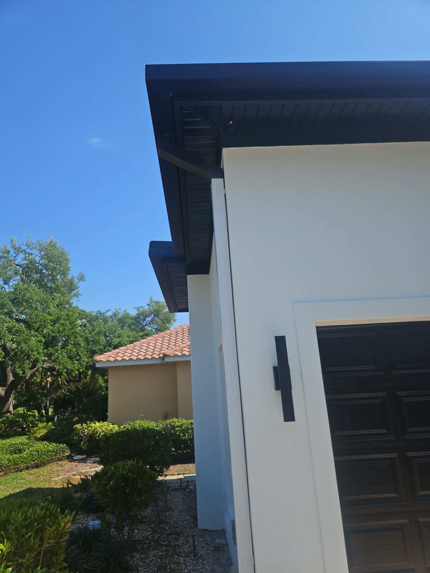 Soffit and Fascia Installation and black seamless gutters in Sarasota FL by Gutter Professors