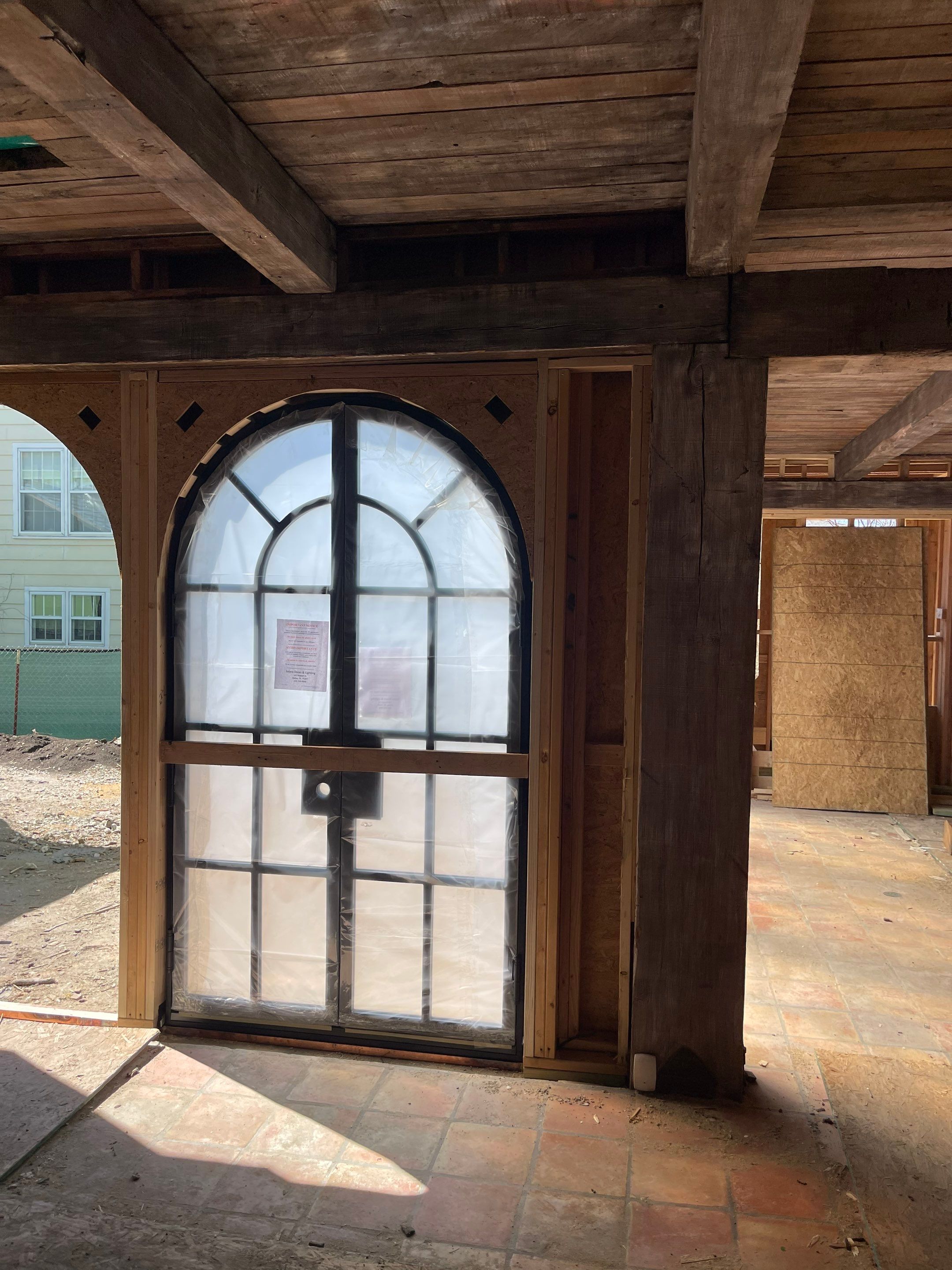 Arched Black Metal French Door Installation and Finishing in Fort Worth by Solara Custom Living