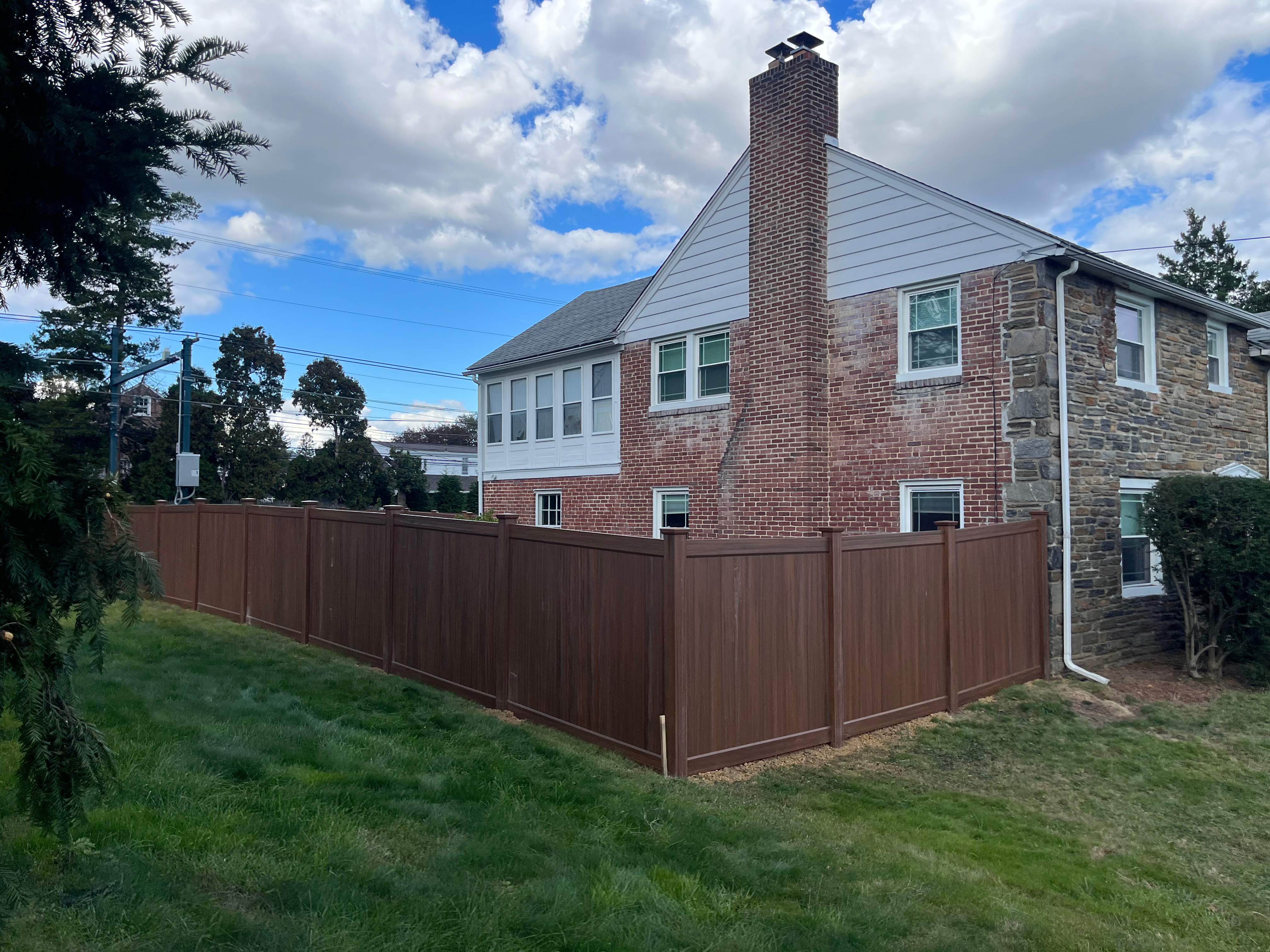 6' High Mocha Walnut Vinyl Installation by Jensen Fencing