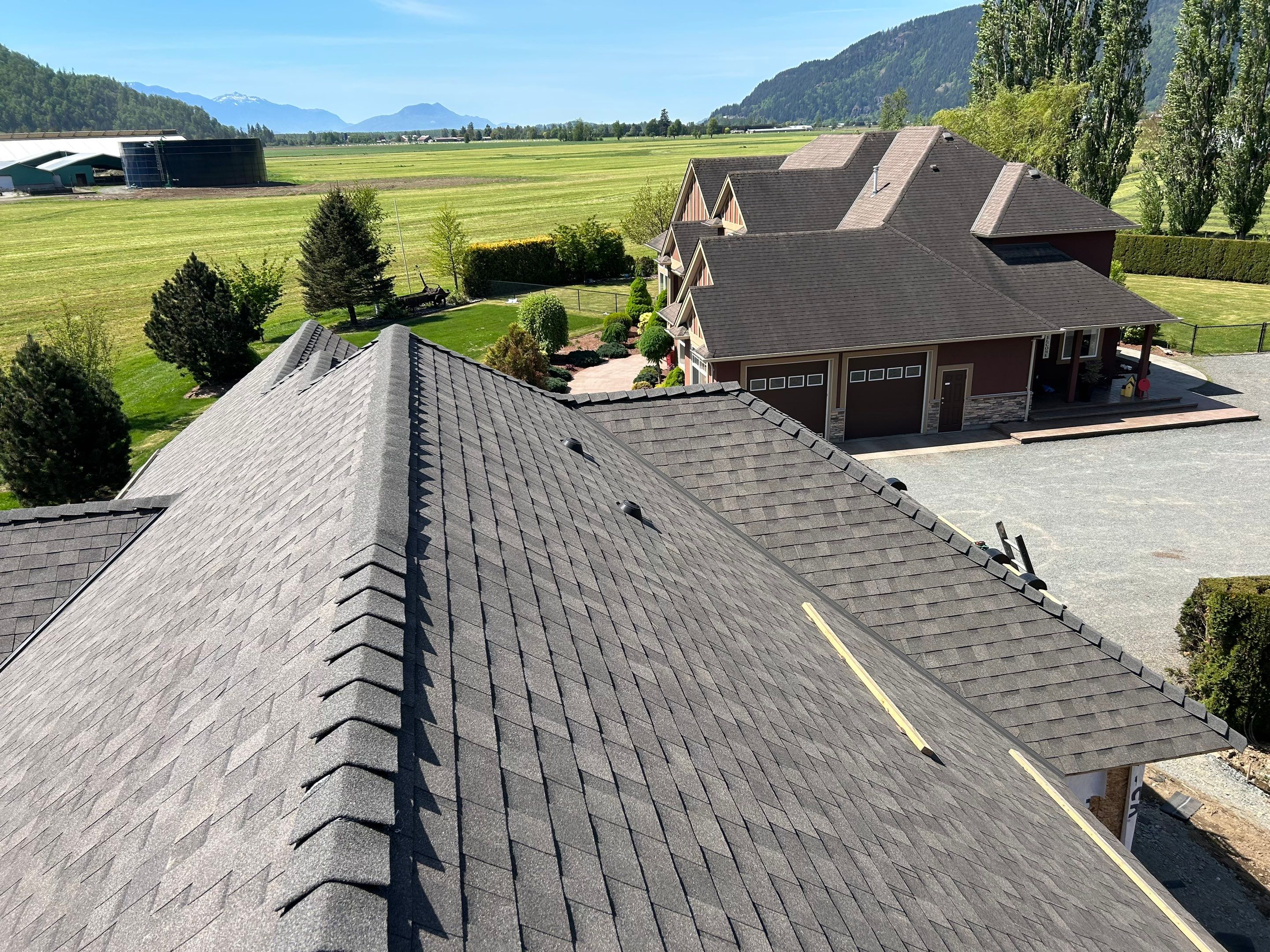 Residential Roofing Installation upgraded venting and hip and ridge capping by Top Notch Roofing Inc