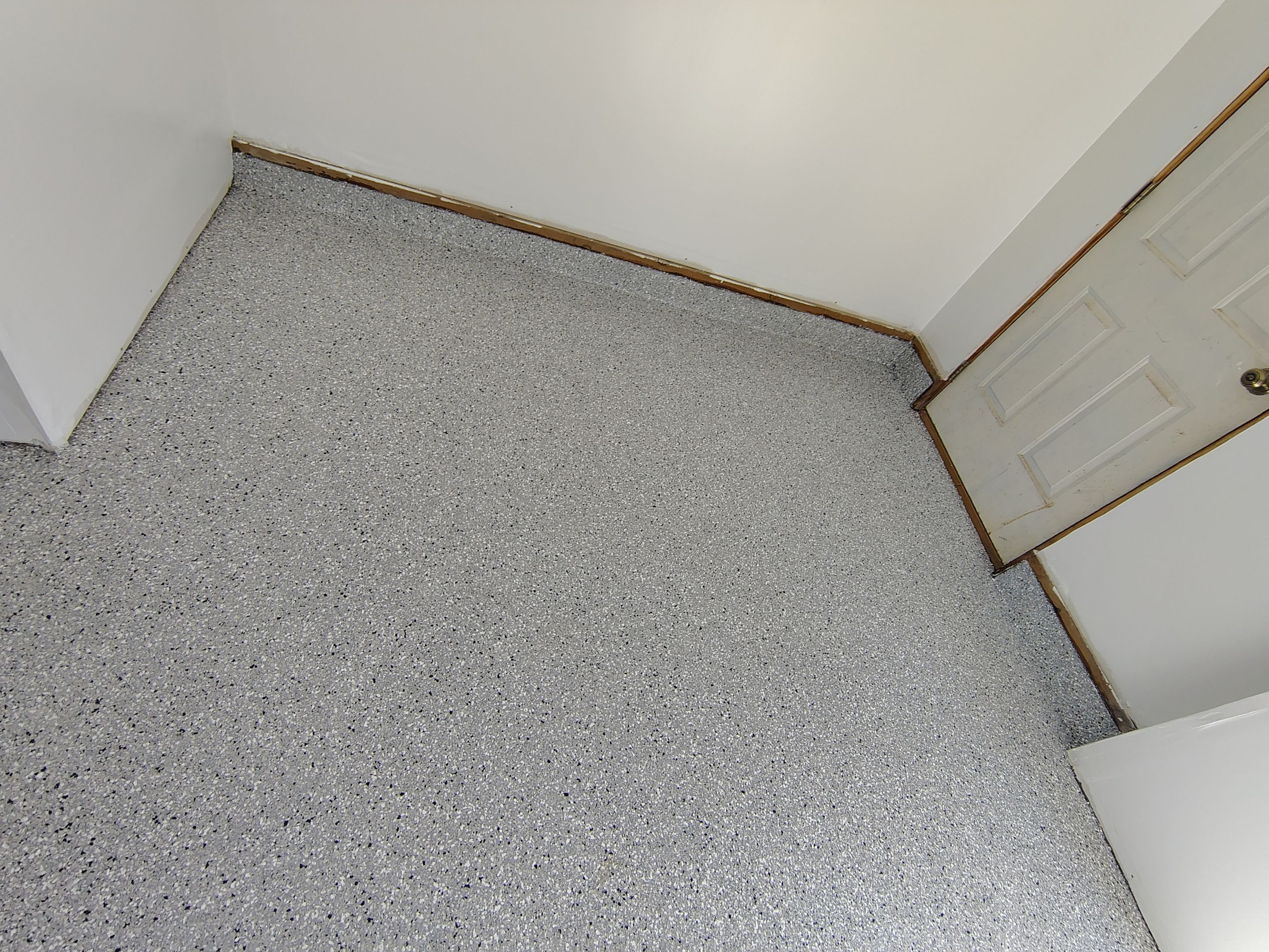 Decorative Chip Concrete Coating Installation in Luverne by Select Painting, Coatings & Garage Cabinets