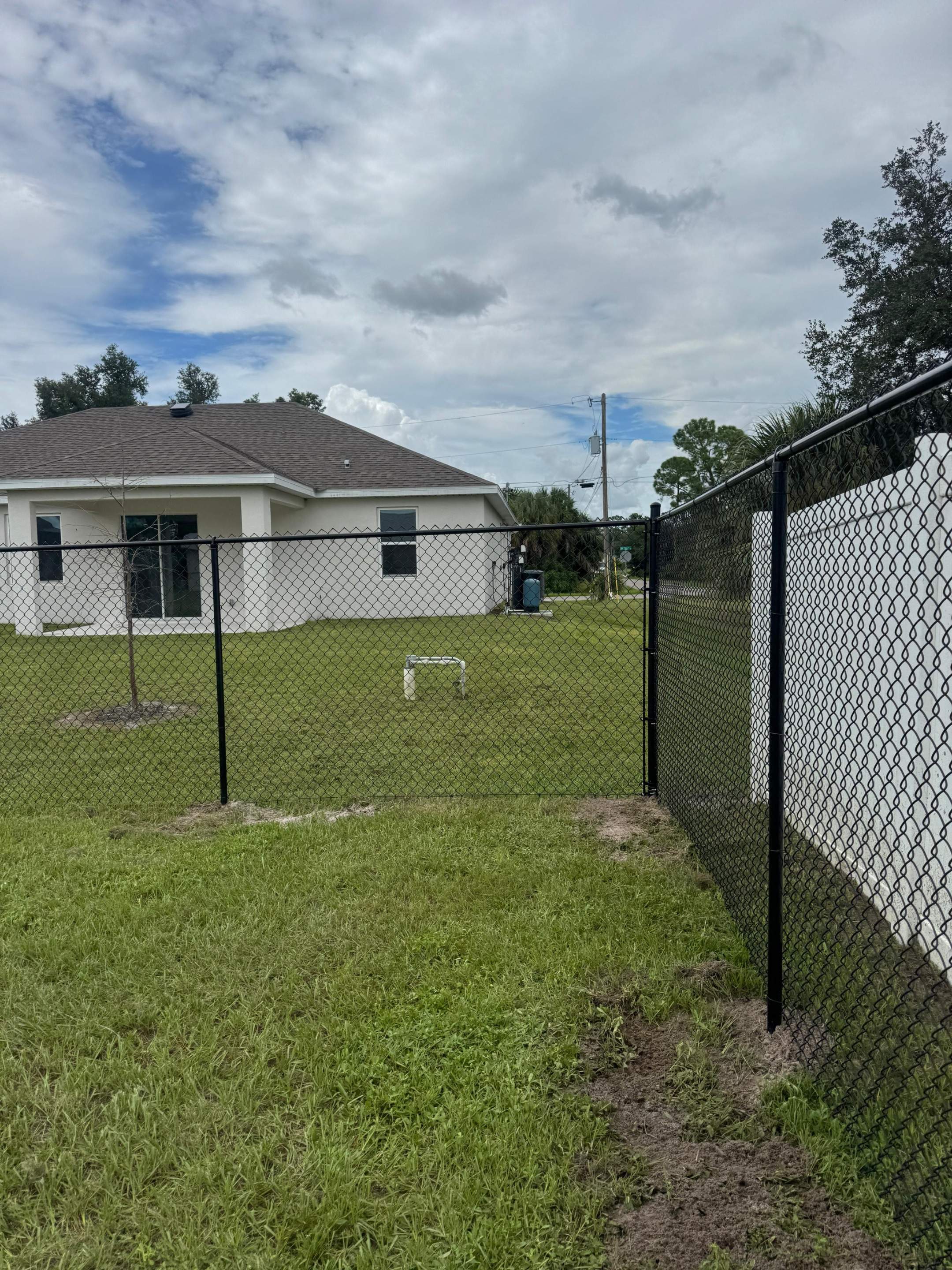 Residential Black Chain Link Fence Installation in North Port by True Fence LLC