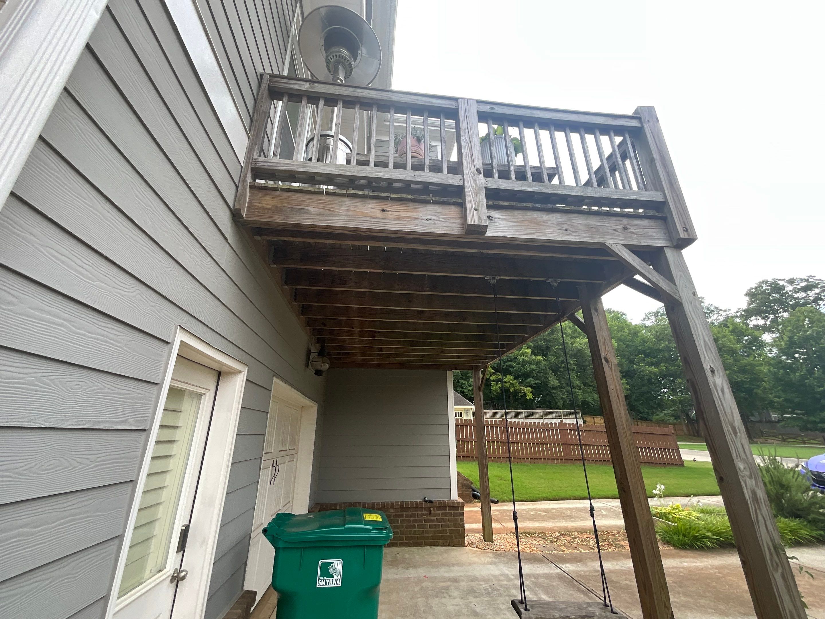 Elevated Composite Deck Replacement with Metal Railings in Smyrna by Swift Home Renovations 