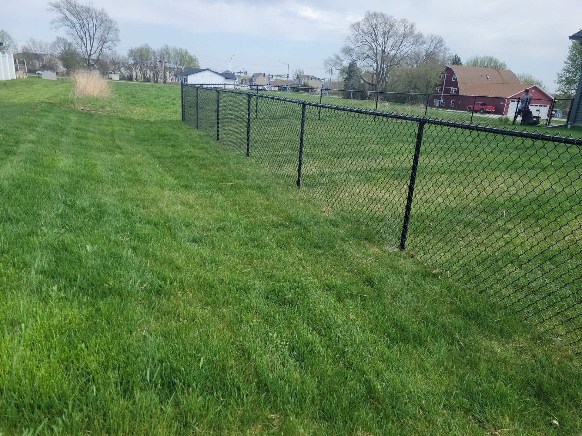Black Chain Link Fence and Gate Installation in Cedar Falls by Perfect Picket Fence and Stain