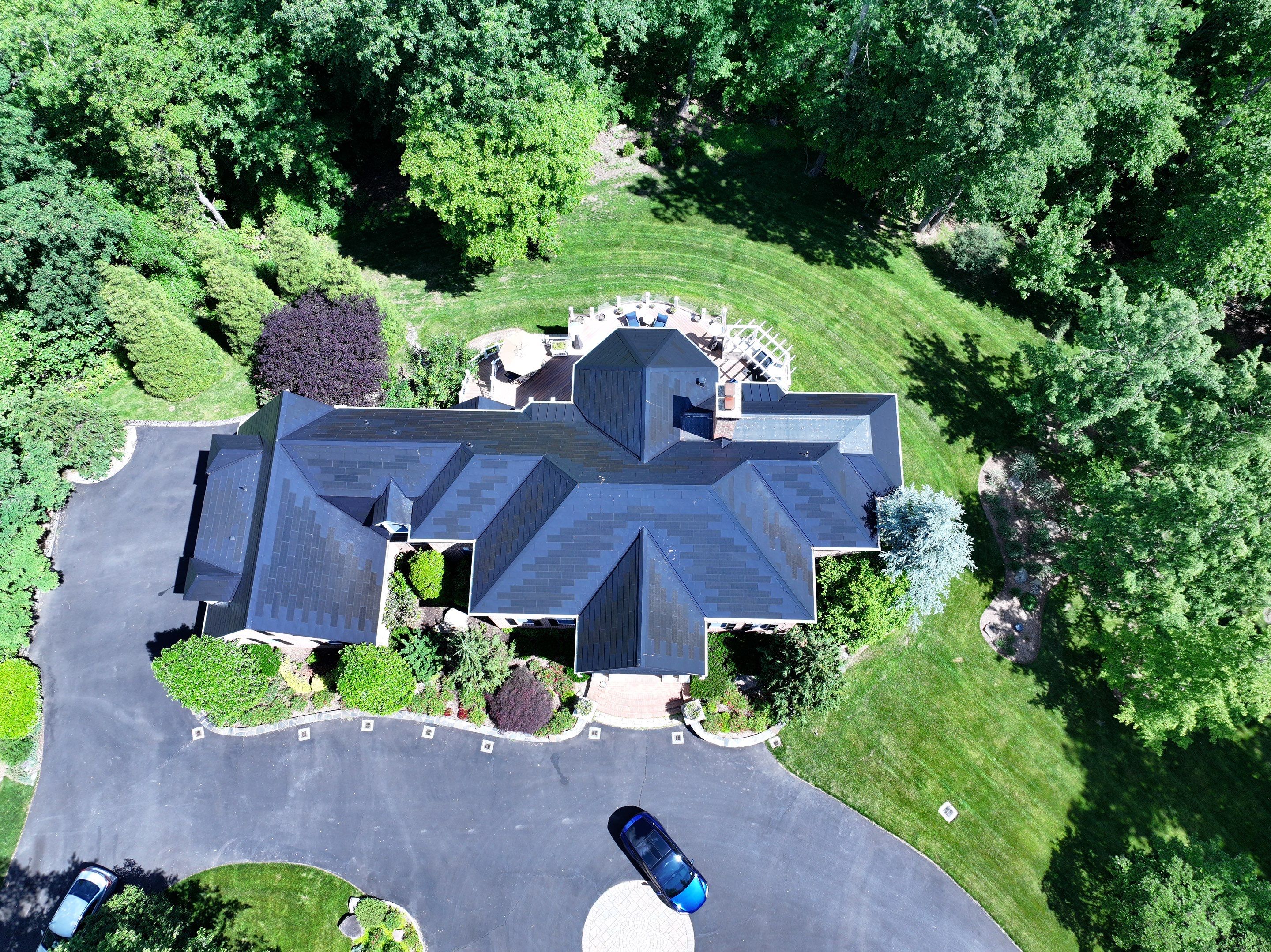 Tesla Solar Roof Replacement by American Home Contractors