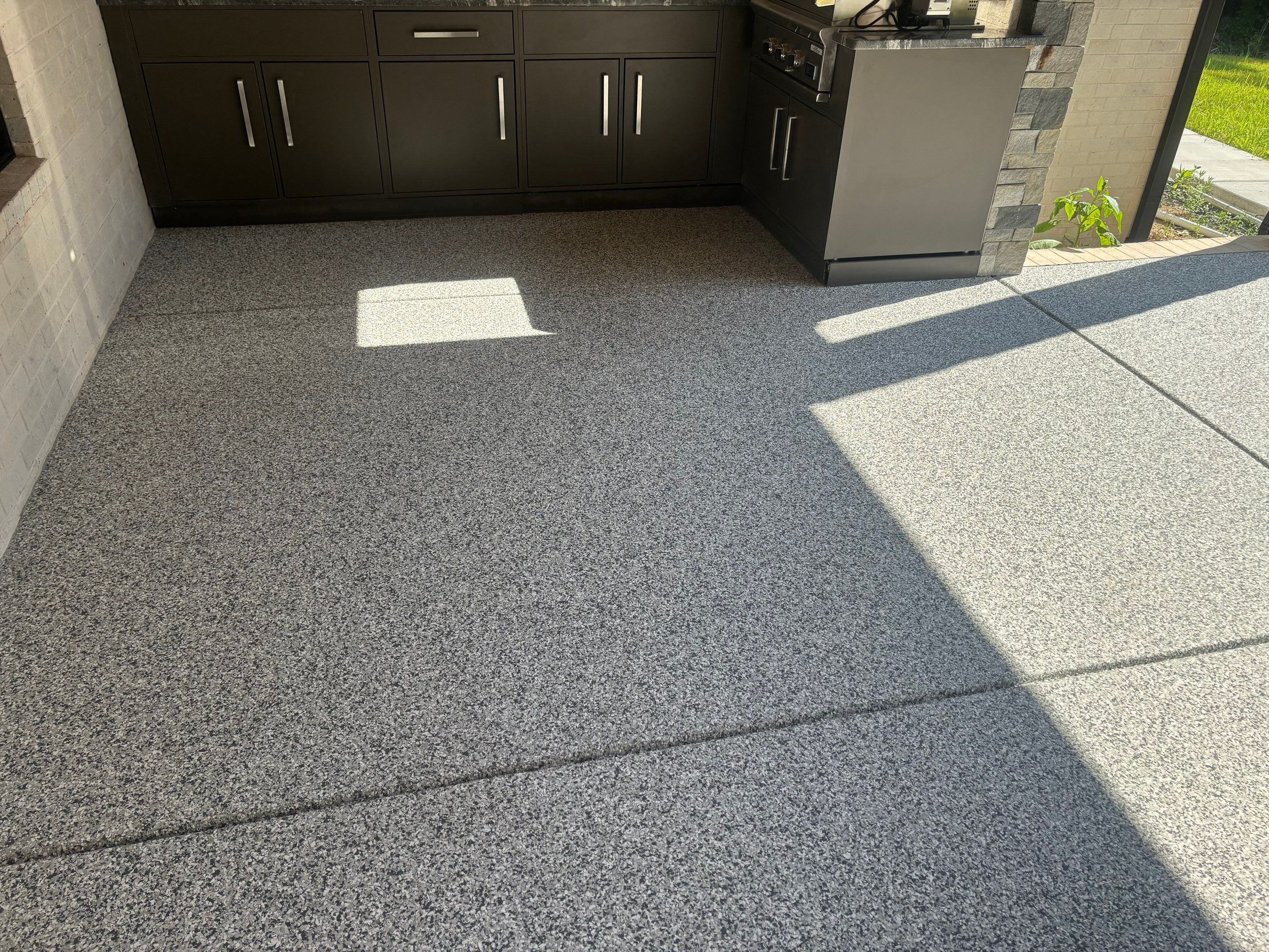 Porch & Garage Using Tidal Wave & Gravel  by Elite Floor Solutions