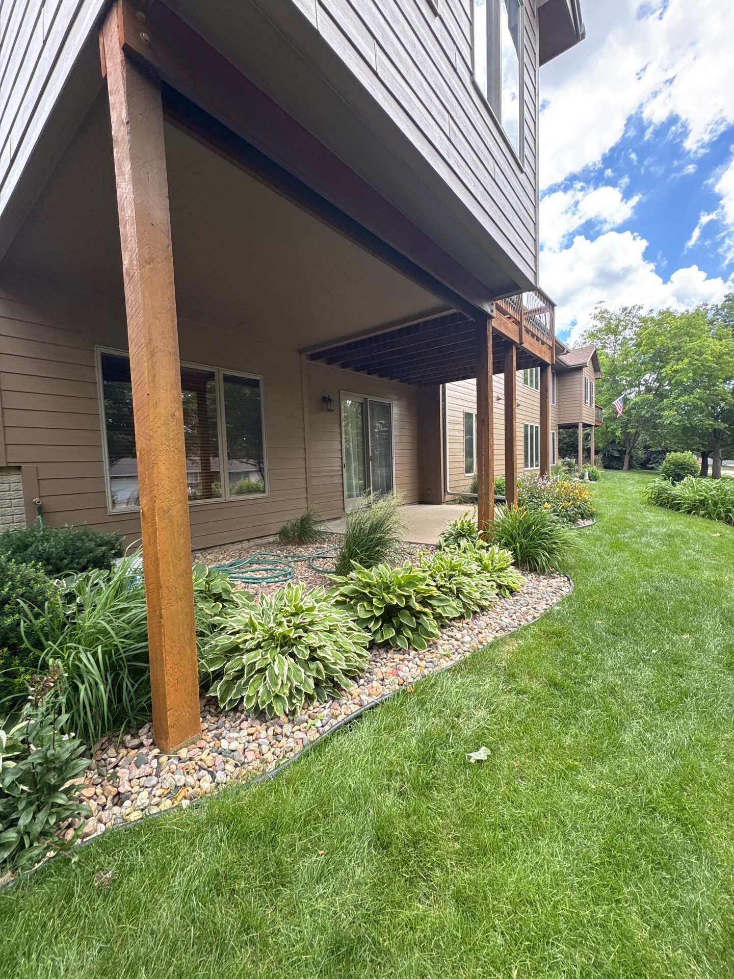 Multi-Story Residential Exterior Painting and Siding Refresh in Sioux Falls by Select Painting, Coatings & Garage Cabinets