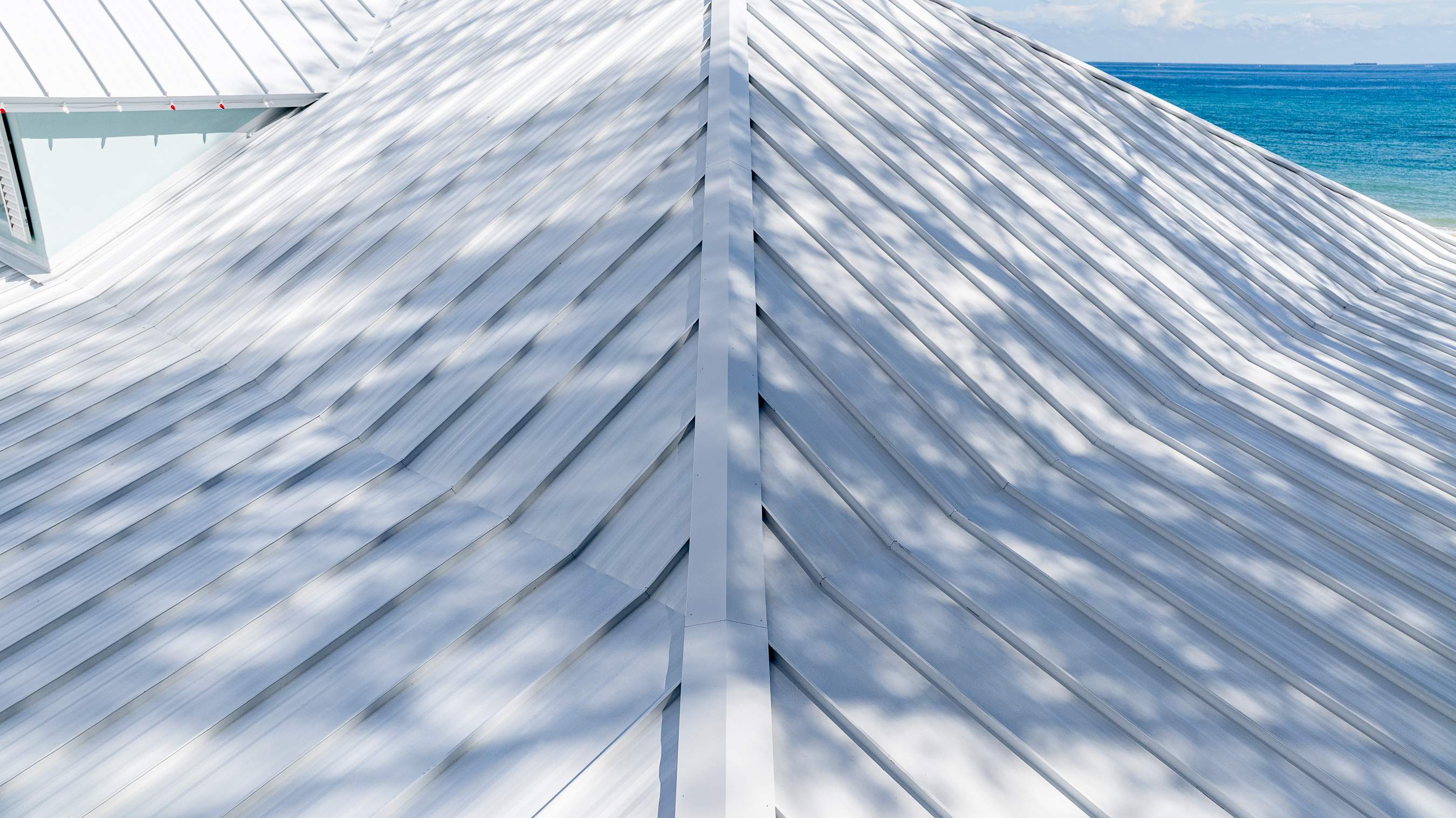 .032 Aluminum 1.5" Mechanical Seam Regal White by Total Roofing System The Metal Roof Experts