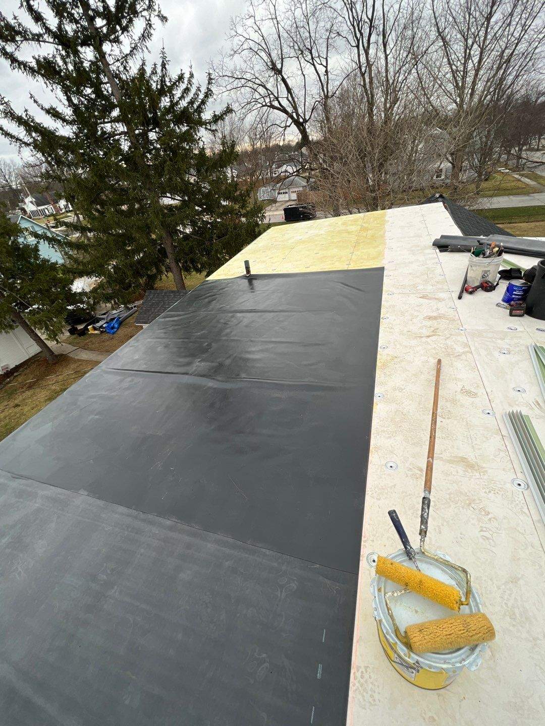 Residential Roofing Installation using 60 mil rubber roof by Nitro Roofing and Construction