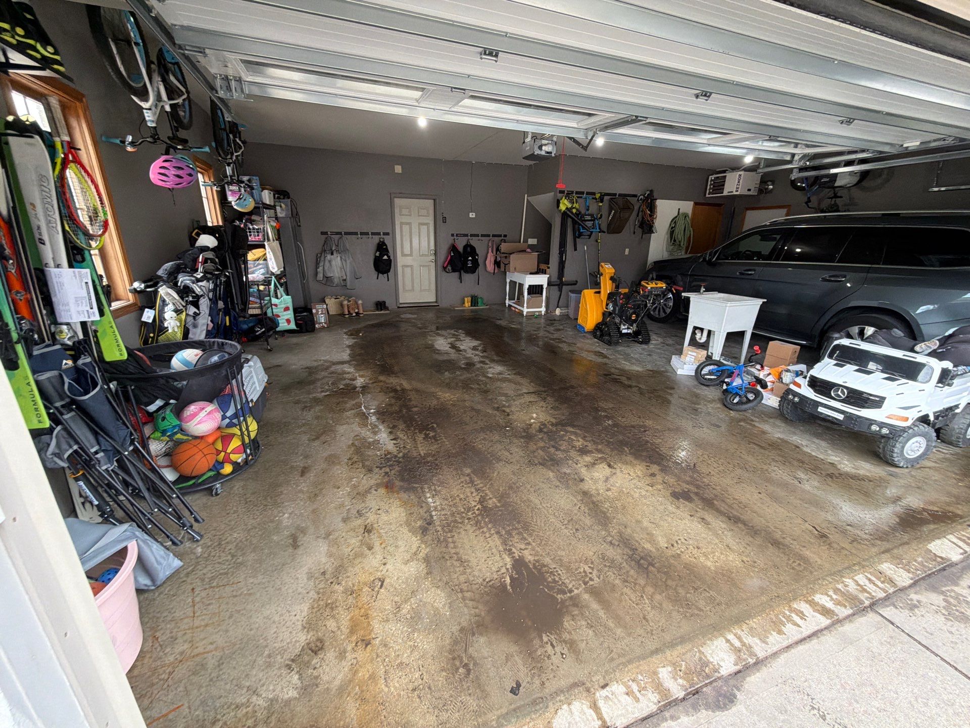 Garage Floor Concrete Coating and Crack Repair in Sioux Falls by Select Painting, Coatings & Garage Cabinets