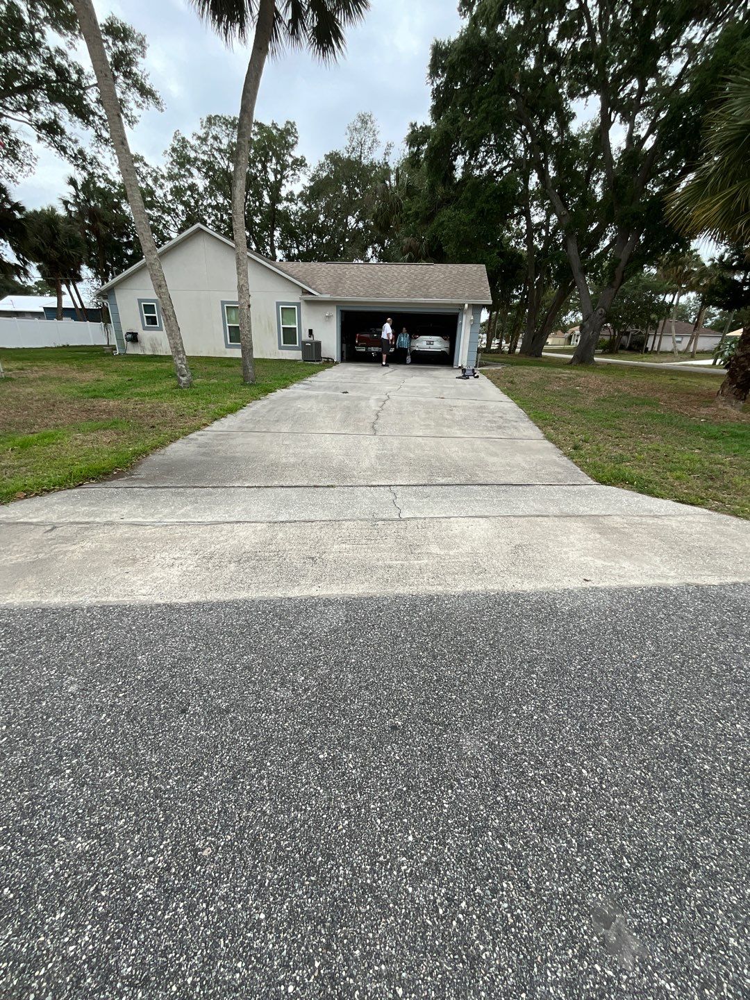 Driveway and Garage using Tidal Wave by Amvet concrete coatings llc