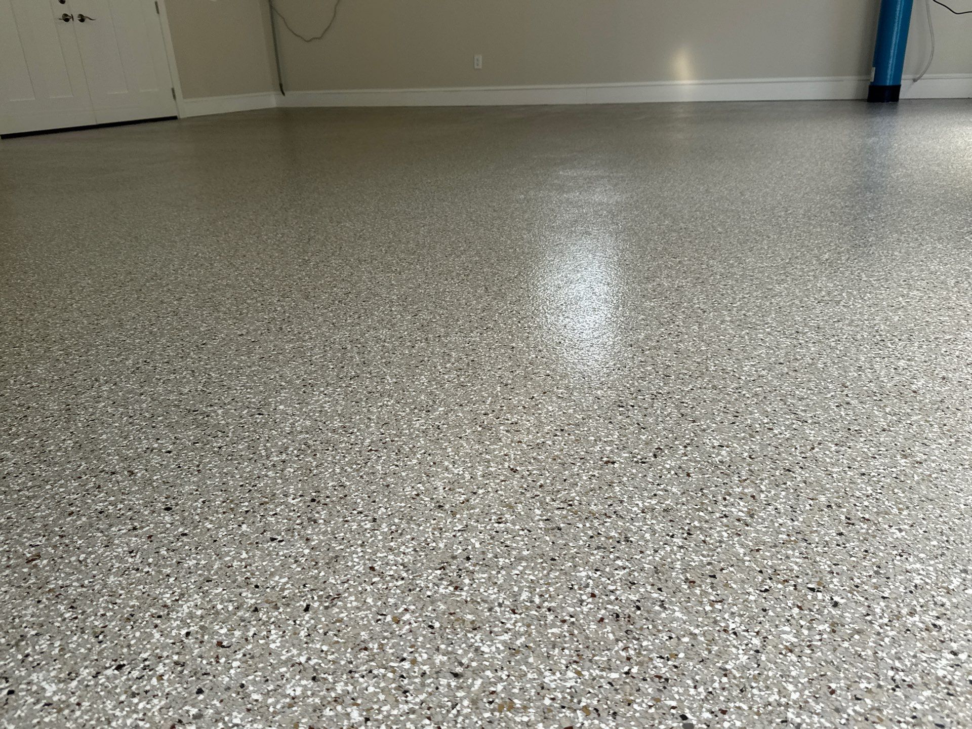 Garage and Sidewalk Project in Keystone Heights, FL in Pebble Beach by Cross Creek Concrete Coatings