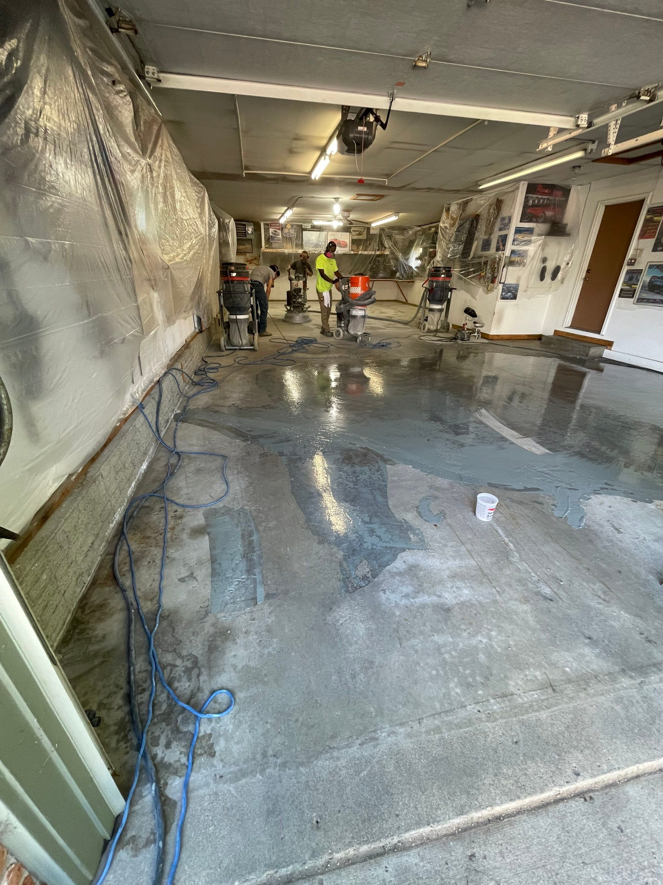 High-Performance Polyurea Garage Floor Coating and Stem Wall Finishing in Sioux Falls by Select Painting, Coatings & Garage Cabinets
