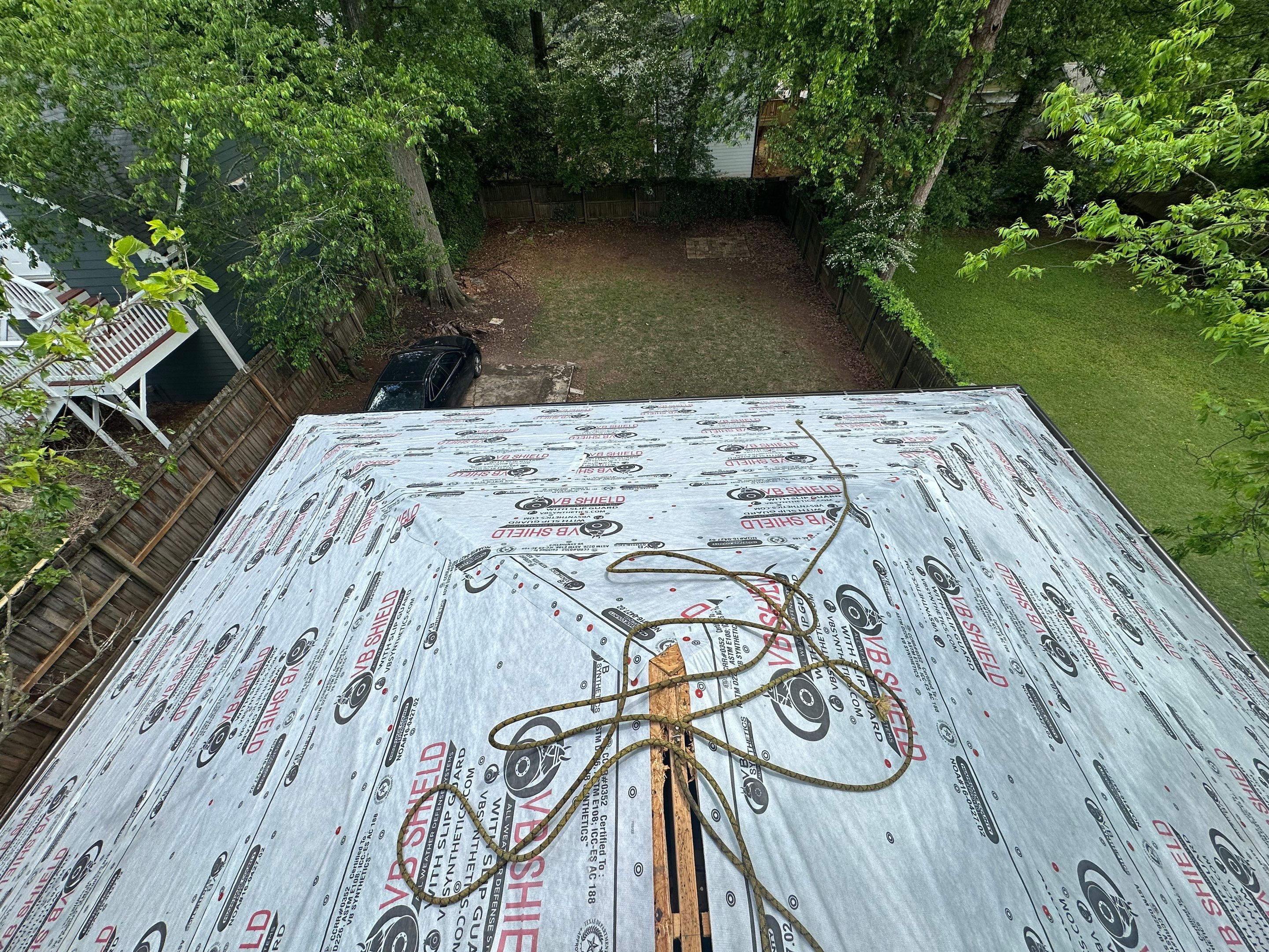 roof replacement and new black gutters by Nailed It Roofing & Remodeling LLC