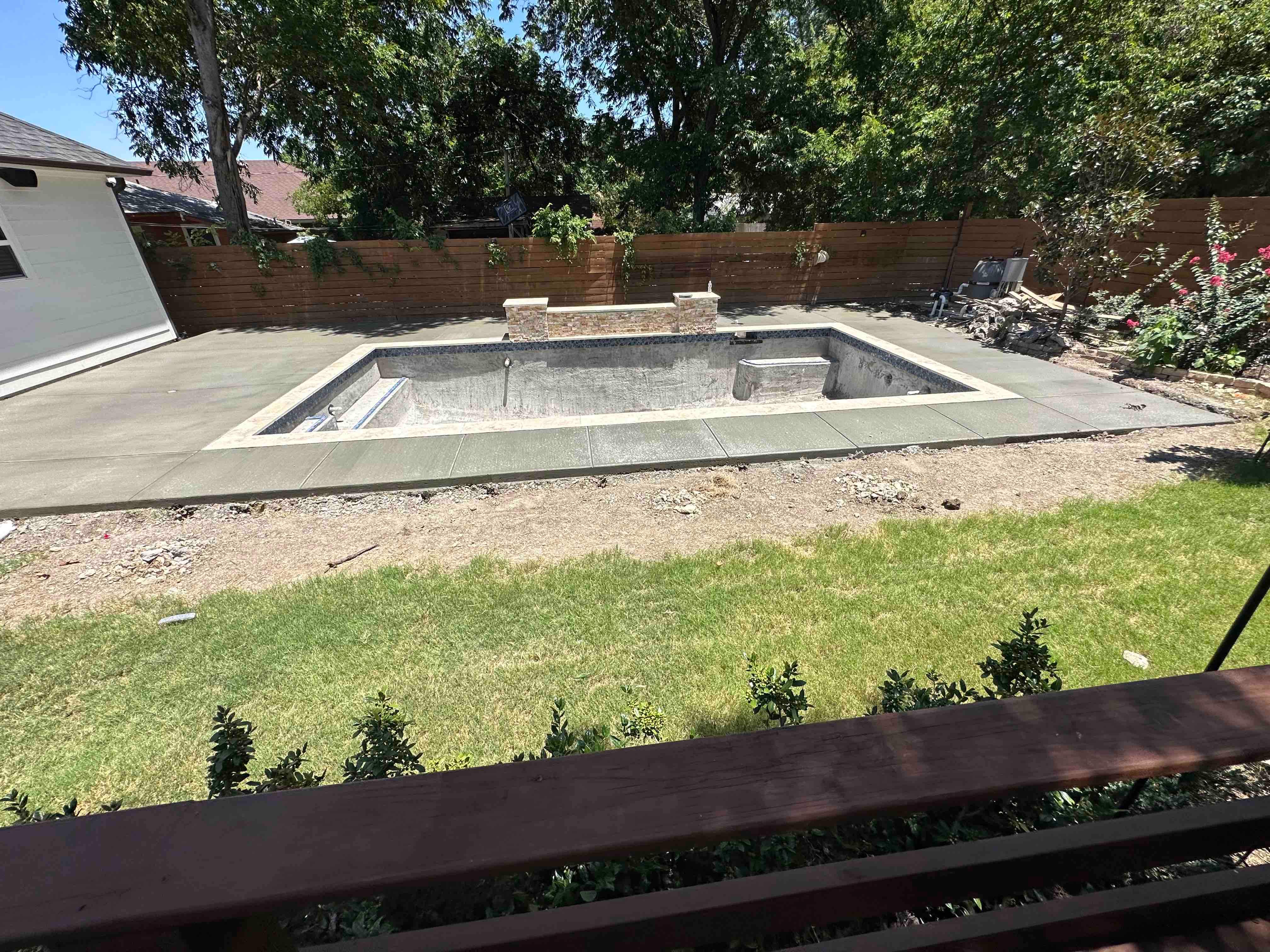 Geometric Pool with Tanning Ledge and Flagstone Decking by Pinnacle Pools and Spas - DFW