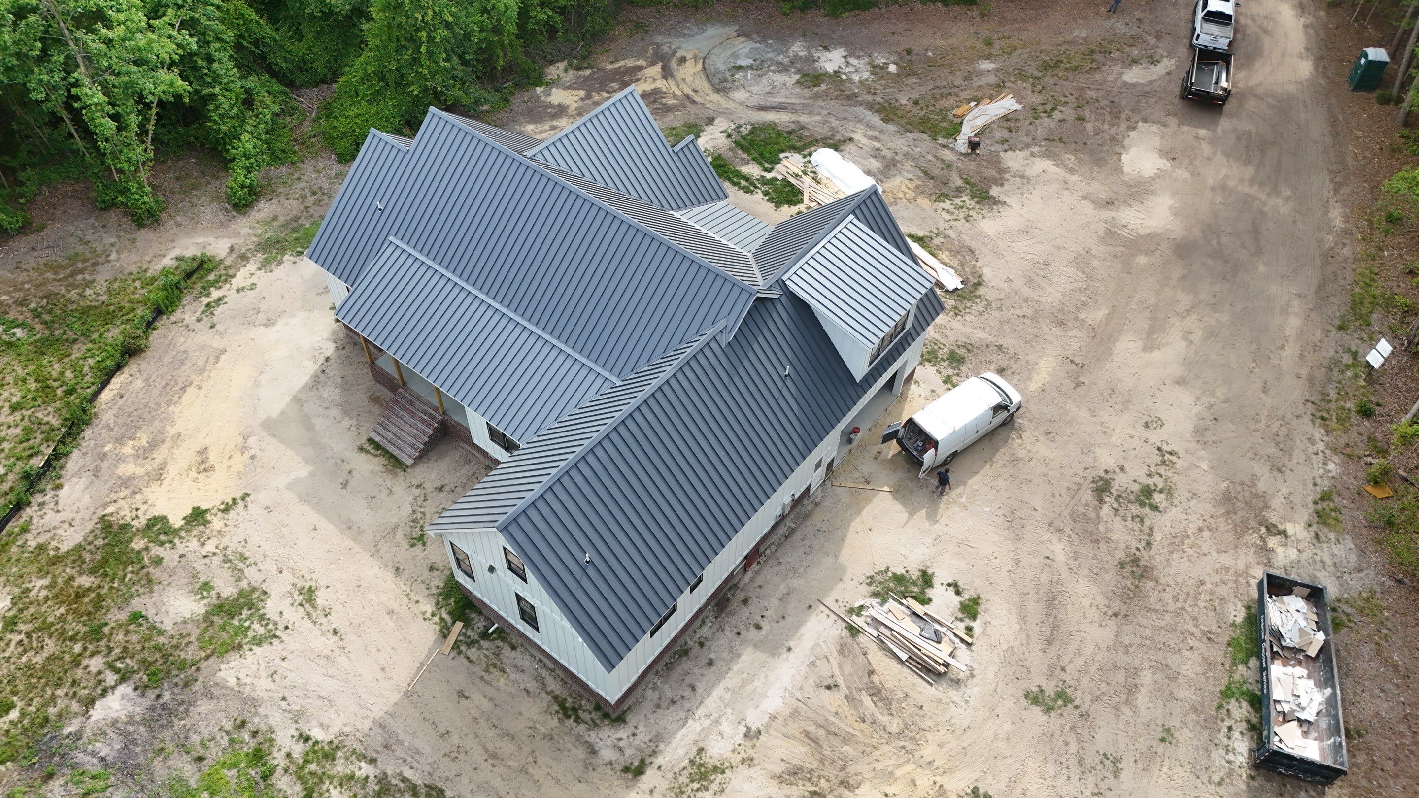 Custom New Construction Home Featuring Standing Seam Metal Roofing in Port Haywood by Cade Construction