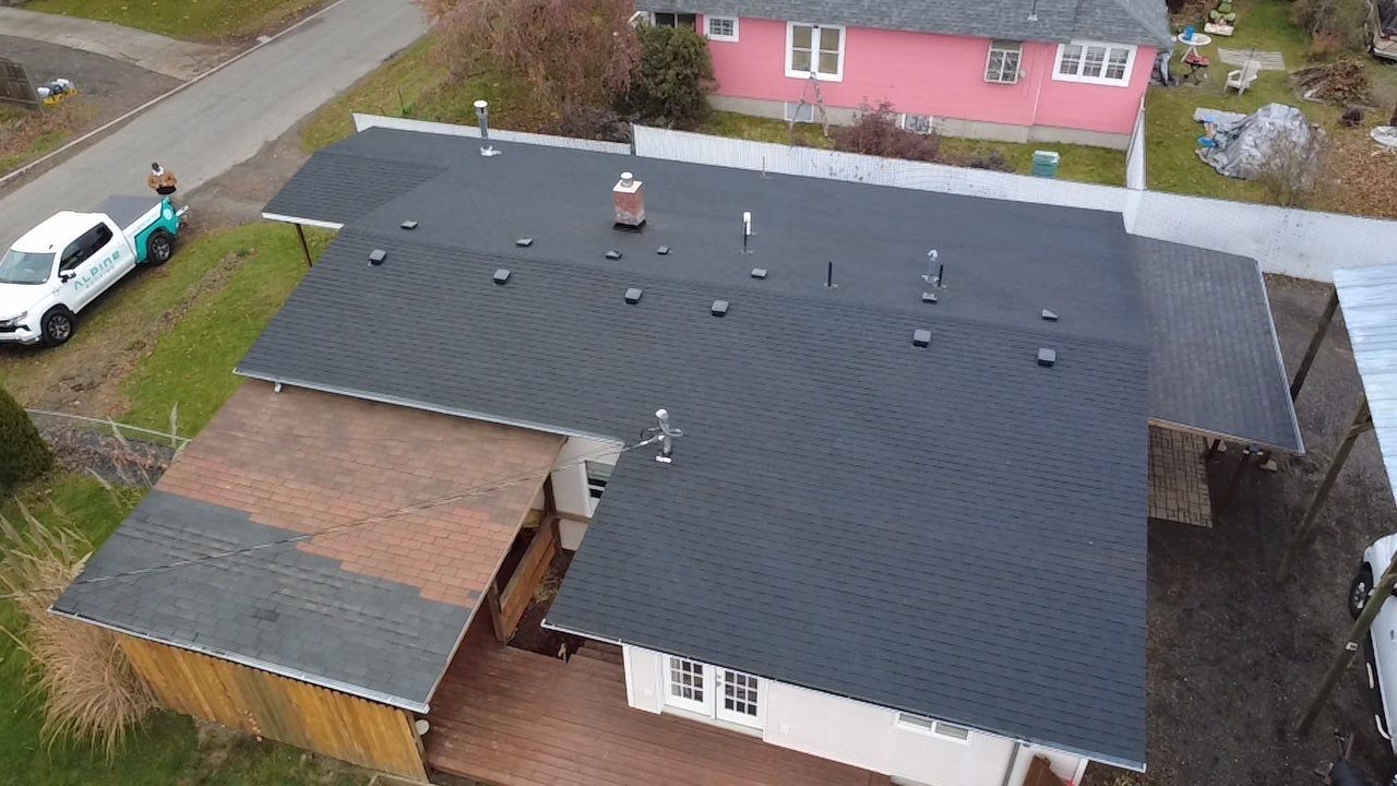 Residential Asphalt Shingle Roof Replacement and Skylight Installation in Spokane by Alpine Roofing