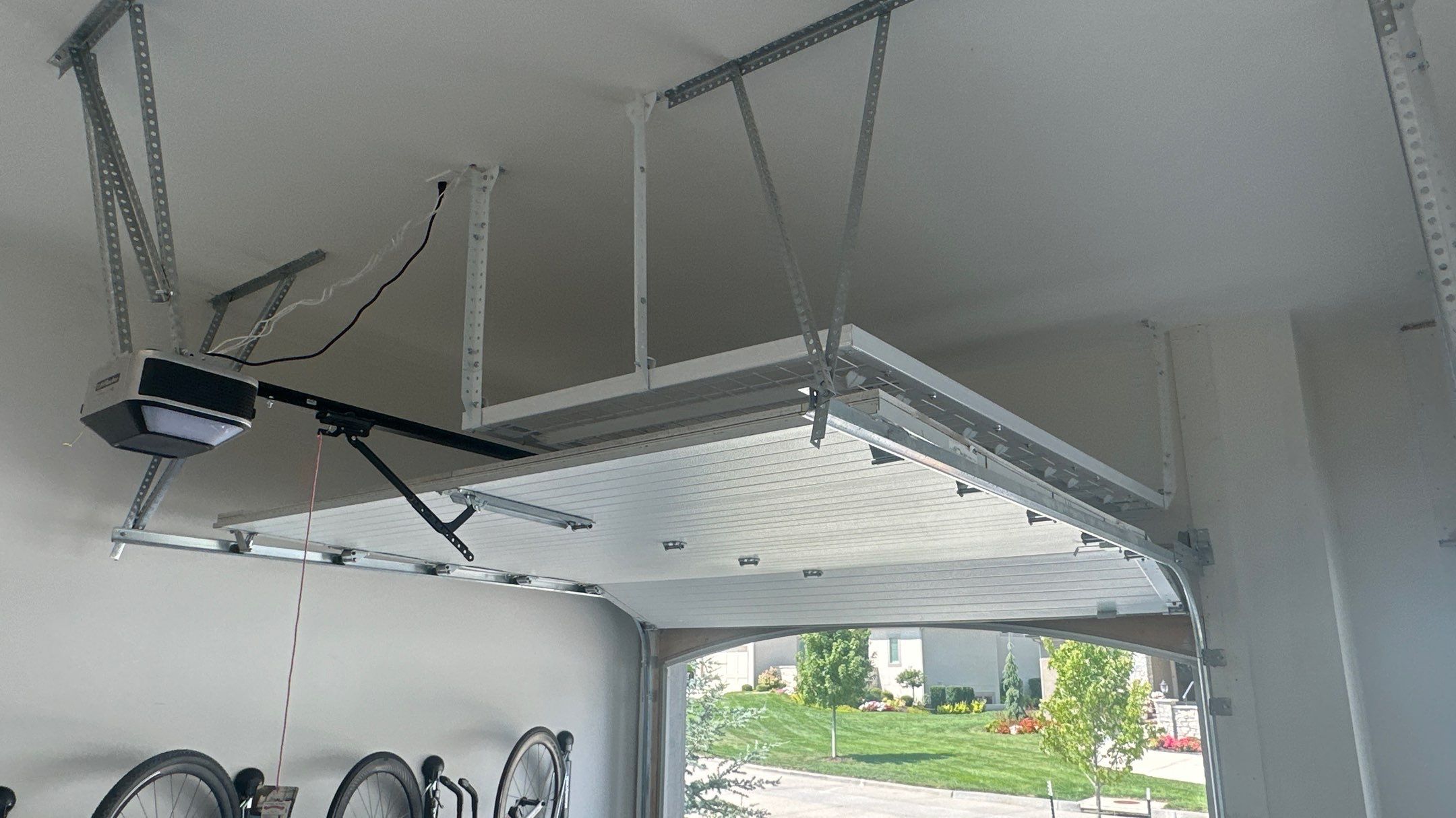 New bike storage for Jason E. along with some overhead racks  by Banner Garage