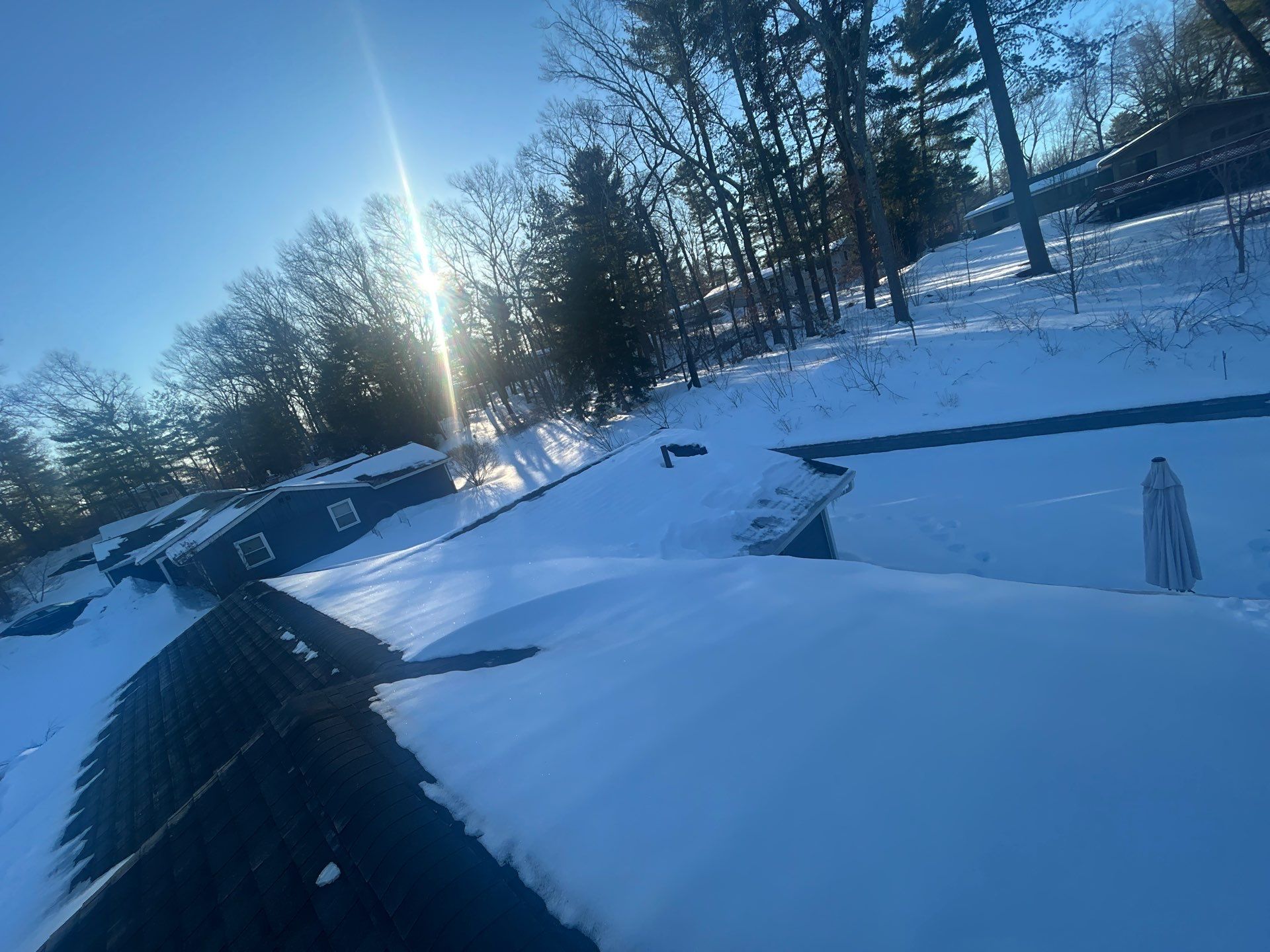 Ridge Cap Replacement & Black Metal Valley Installation in Chelmsford, MA by Mighty Dog Roofing of Greater Middlesex County
