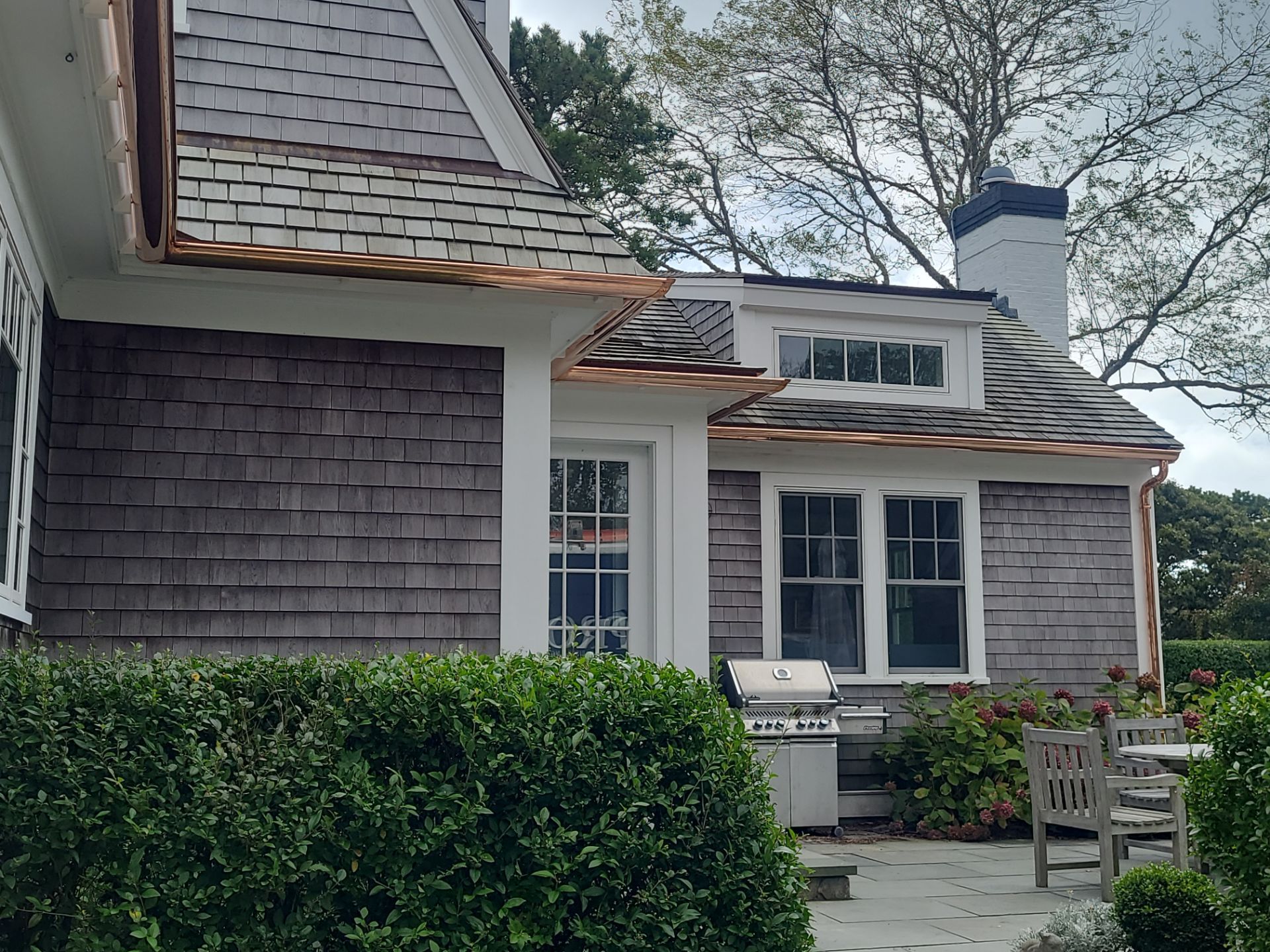 Gutter Installation using 6" Half Round Copper Gutter and Vinyl wedge buildout by Gutter Pro Enterprises