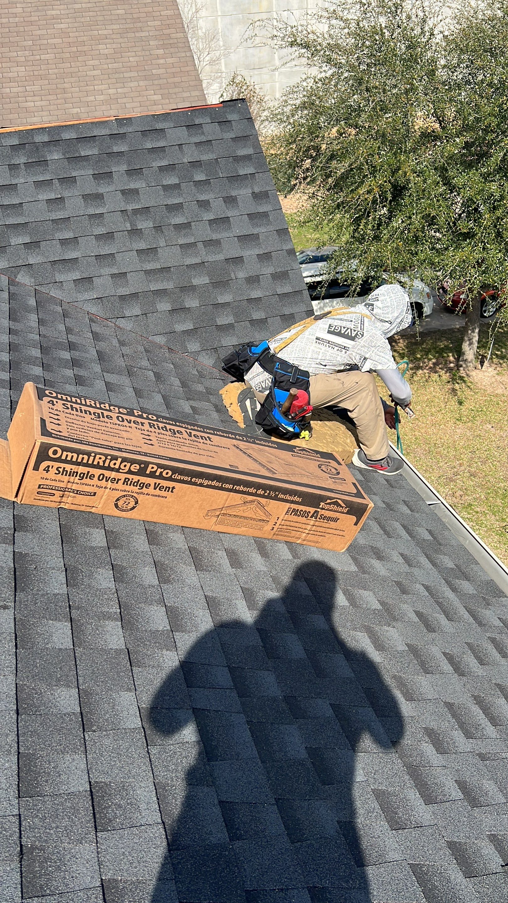 Slate-Gray Roof on Stone-Front Home — Spring, TX by PL Roofing & SB Roofing, LLC.