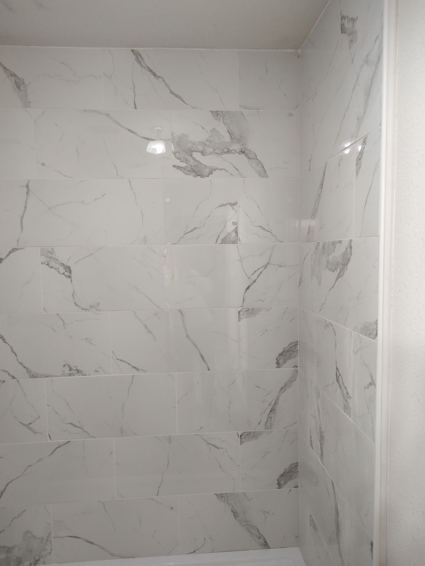 Bathroom remodel w/shower upgrade by In & Out Construction & Remodeling, LLC