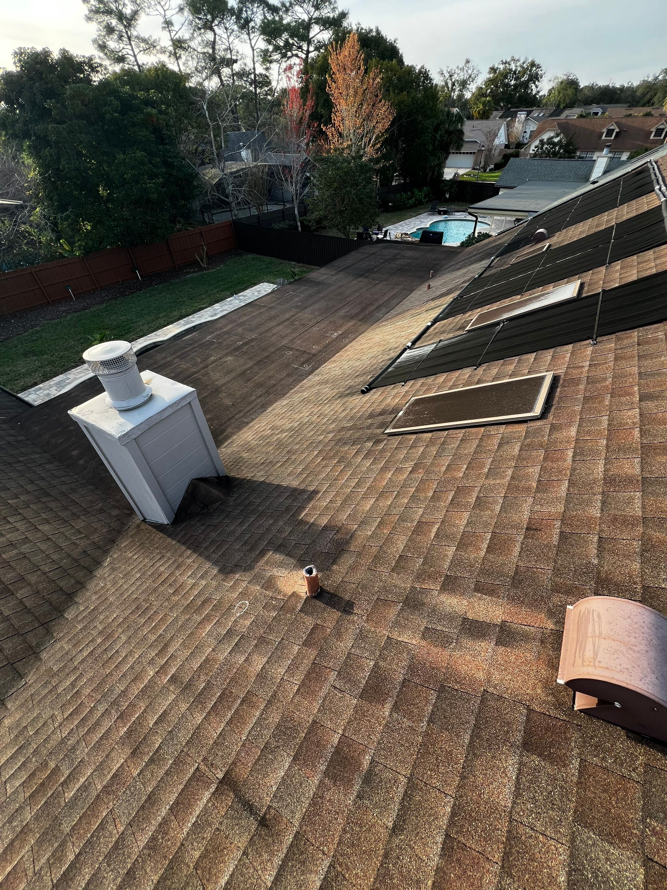 Asphalt Architectural Shingle Roof Replacement and Solar Integration in Longwood by Fortified Roofing Solutions Corp.