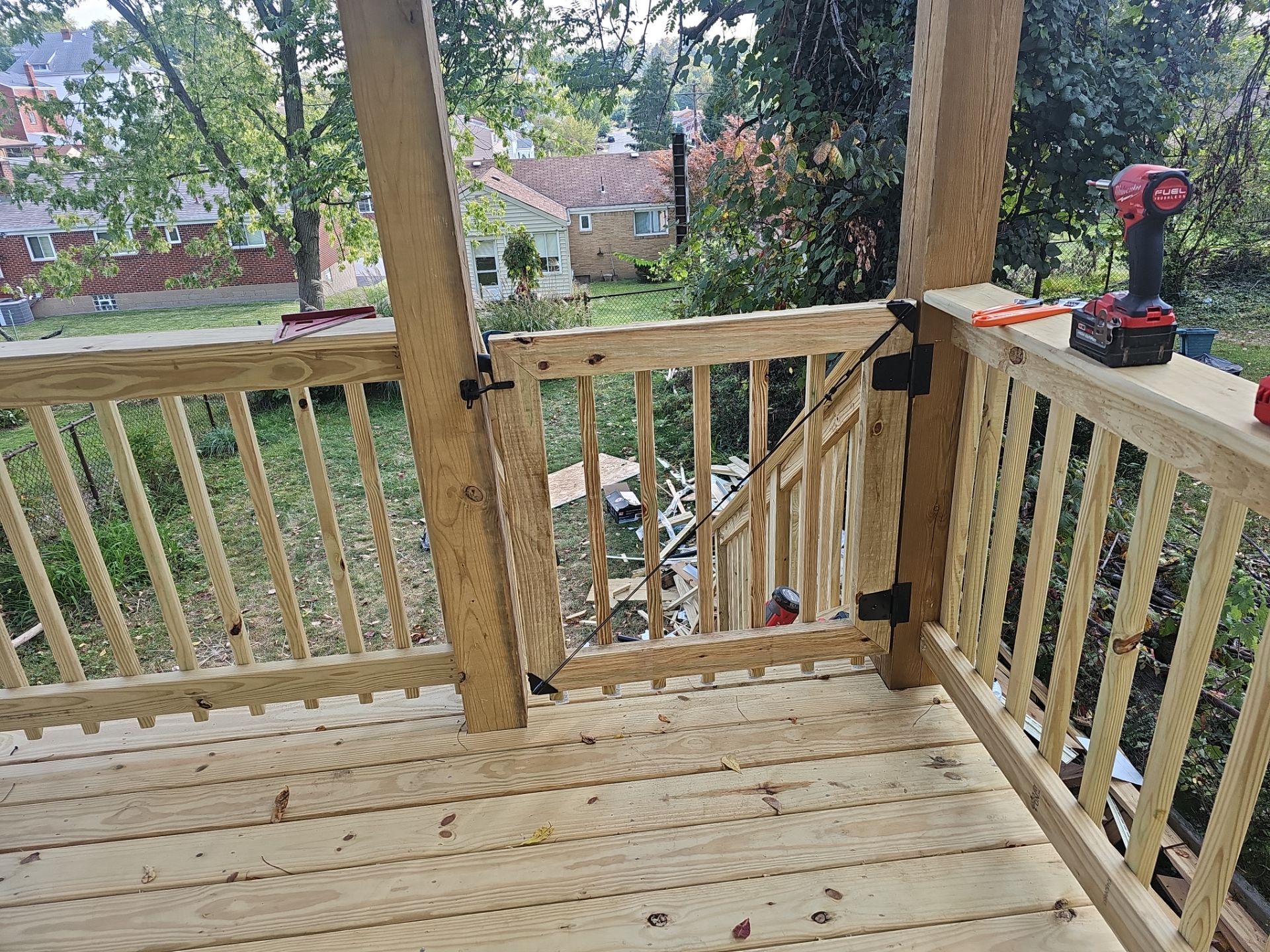 Deck and shed roof by Cousins Roofing Siding & Decks