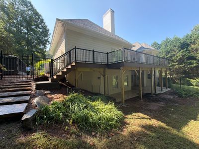 Elevated Composite Deck Replacement with Metal Railings in Smyrna by Swift Home Renovations 