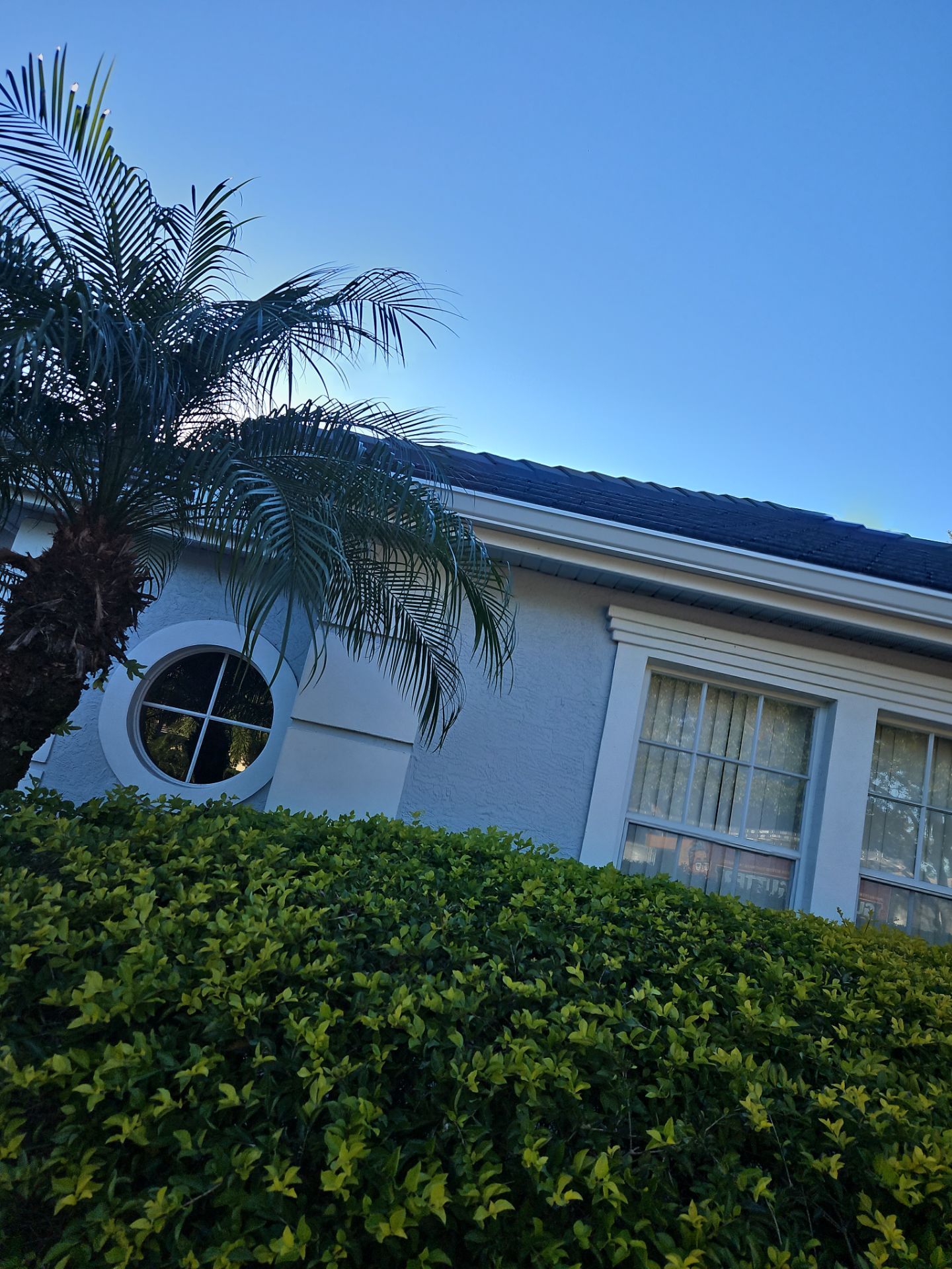 White Down Spouts using downspouts and White Seamless Gutters in Sarasota FL by Gutter Professors