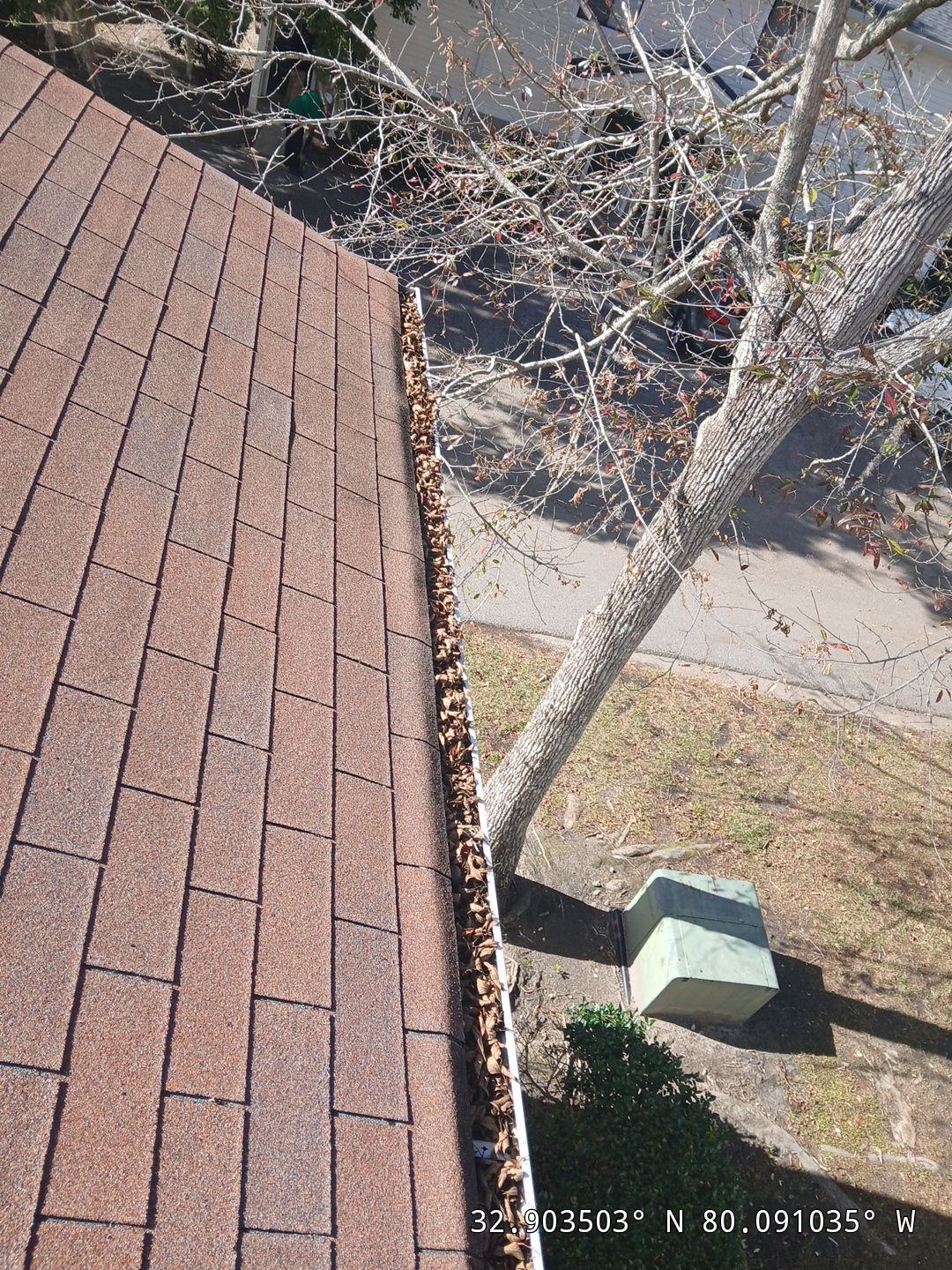 Commercial gutter cleaning Ridgeville, SC before photo with filled gutters