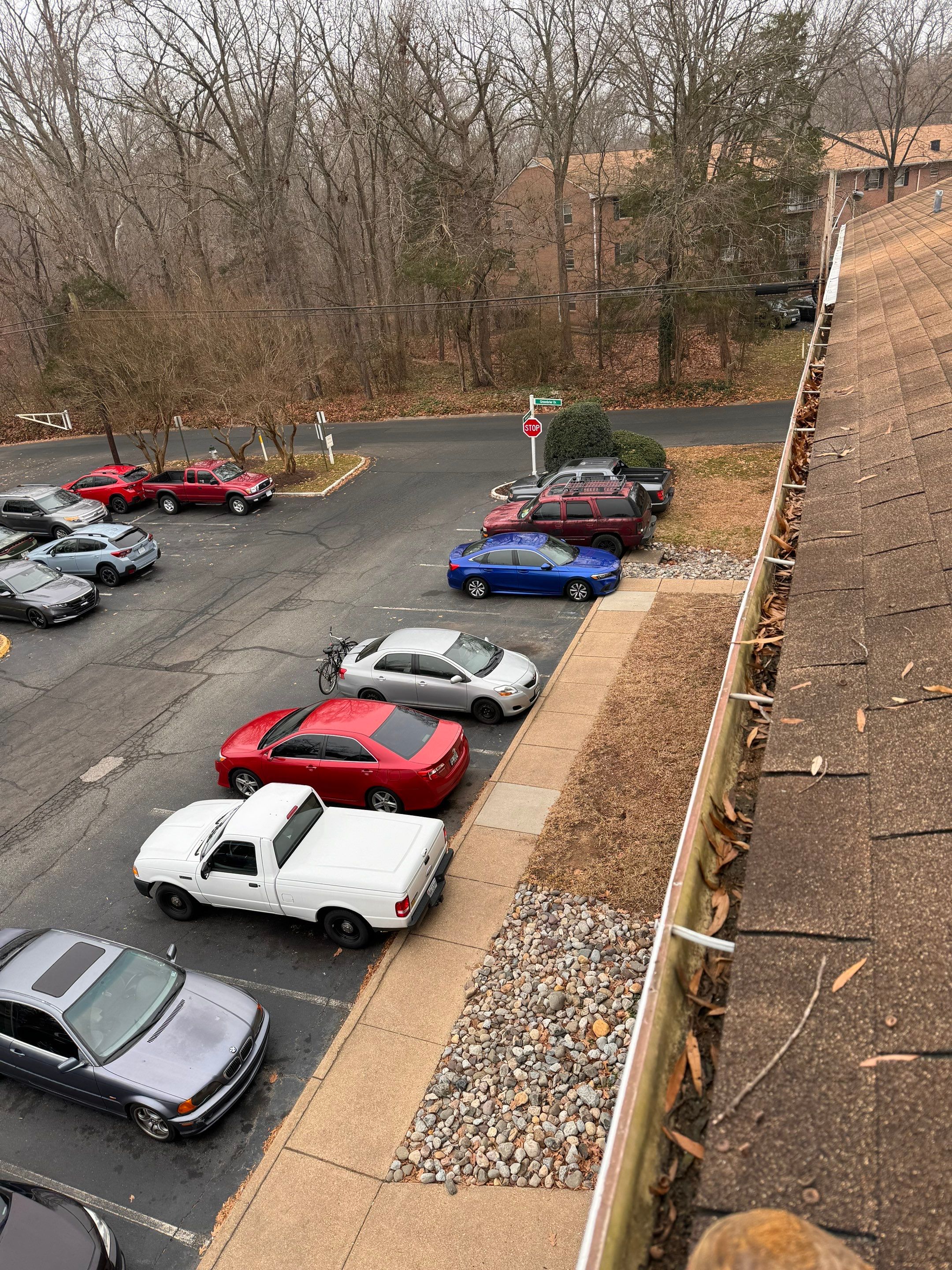 Commercial gutter cleaning Fredericksburg, VA before photo with filled gutters